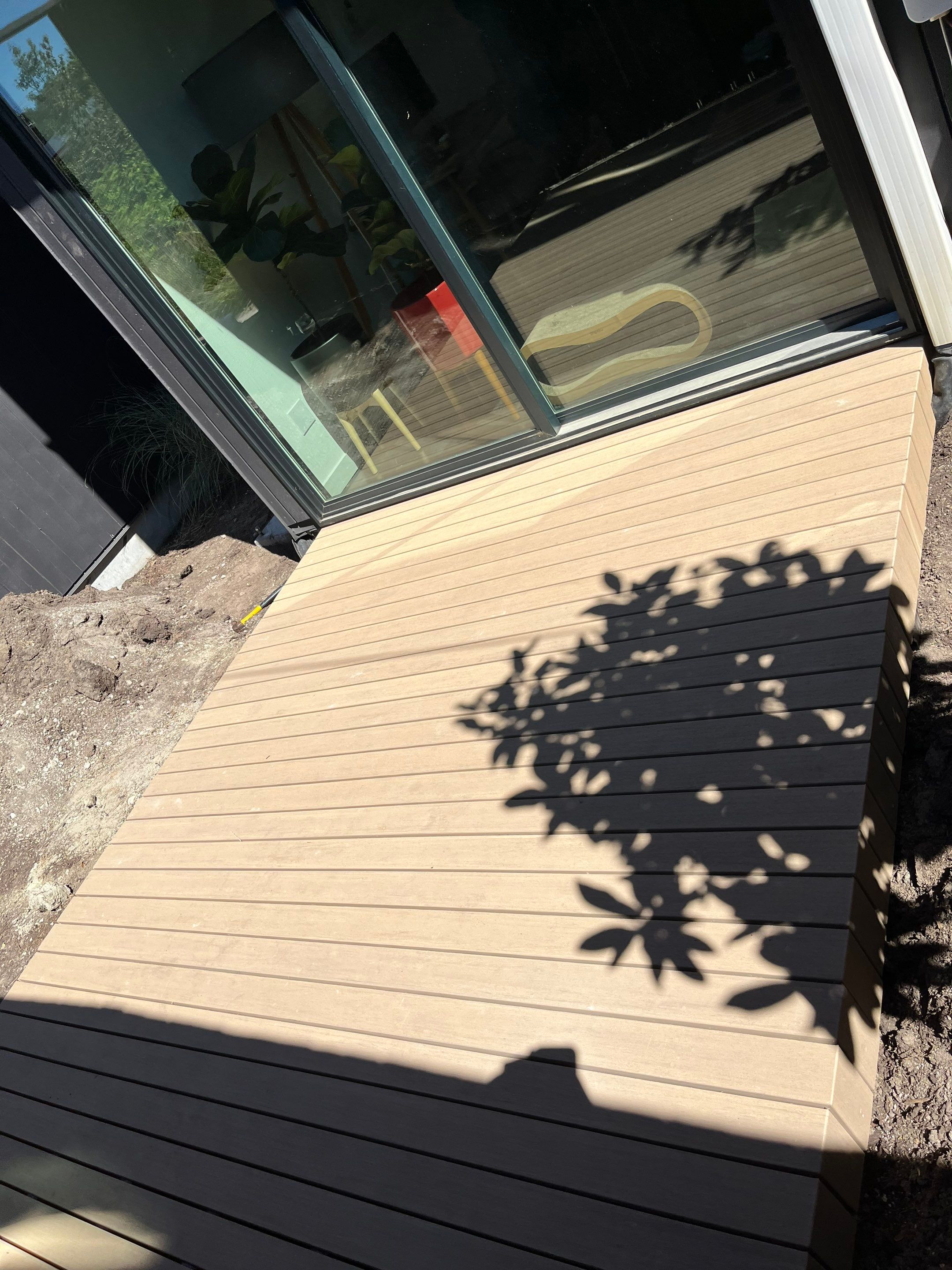 Modern Backyard Deck by Alki deck builders 