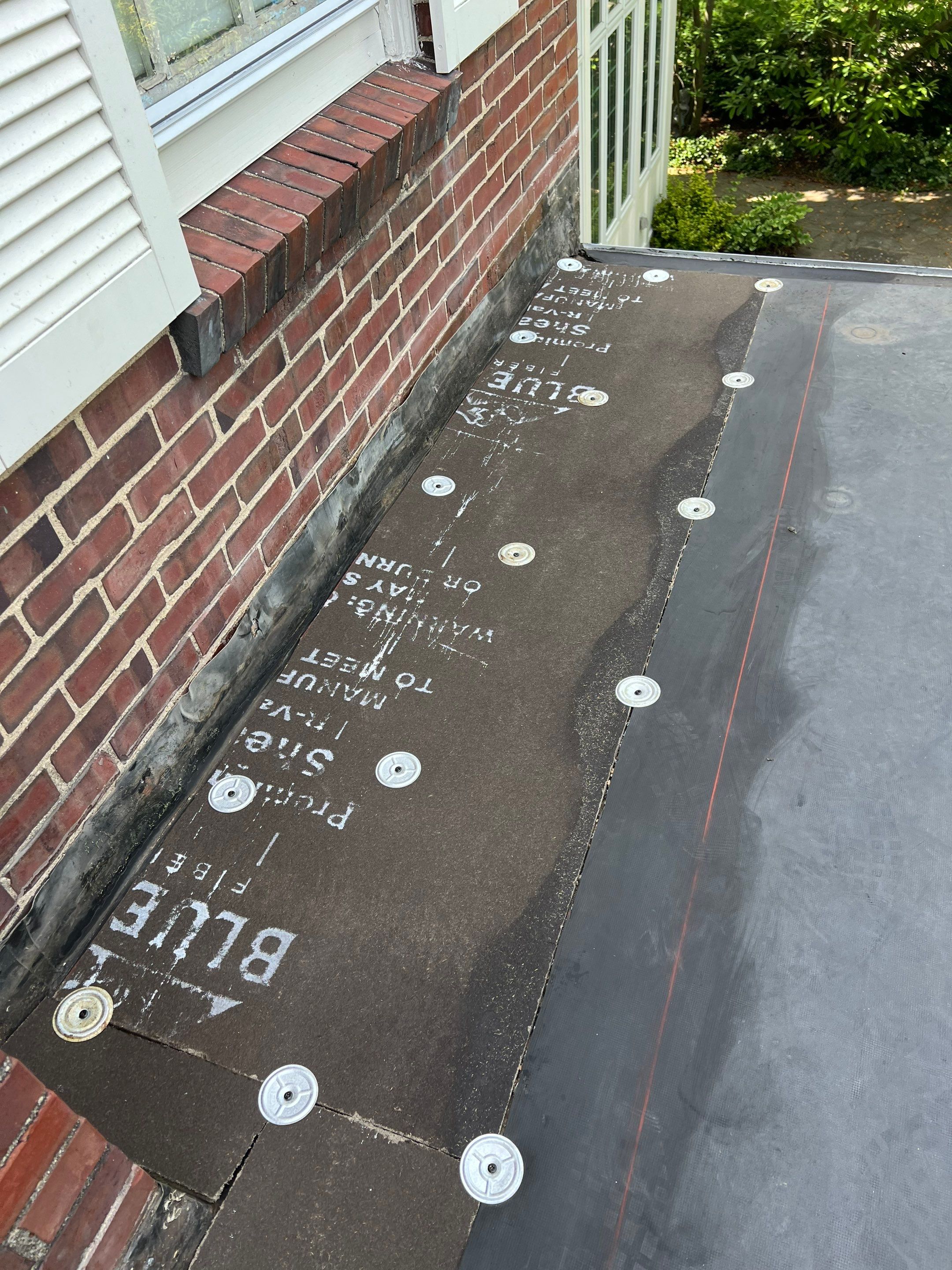 Residential Roofing Installation using 60 mil rubber roof  by Nitro Roofing and Construction