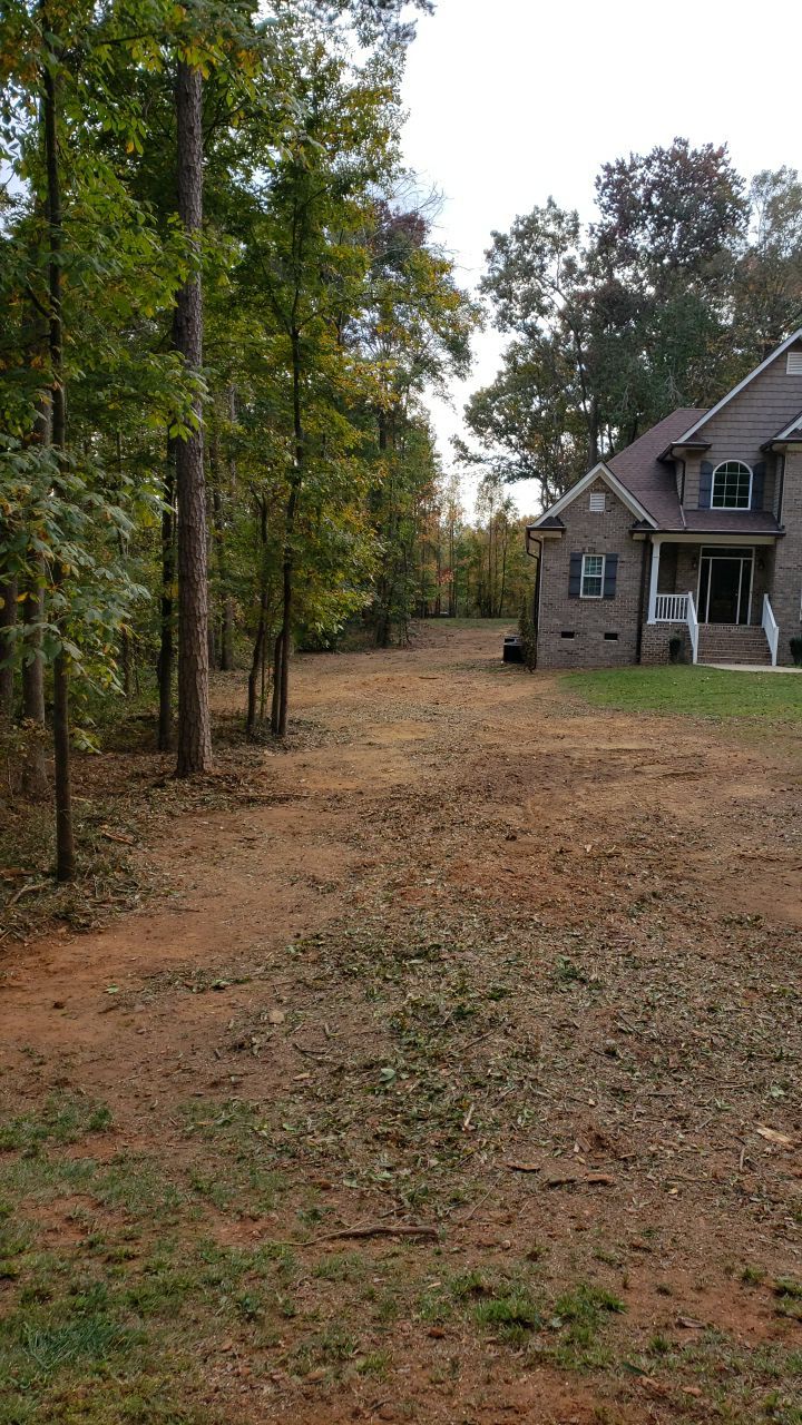 land clearing using machinery by Power Wash Masters LLC