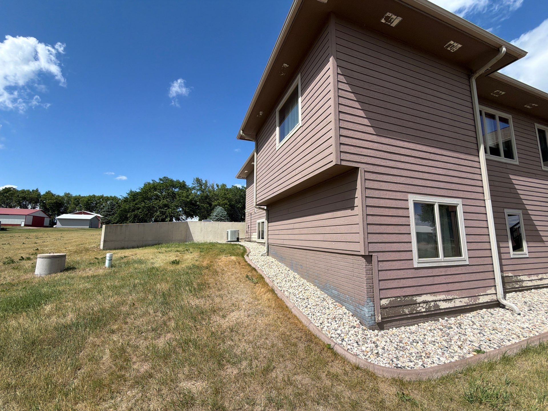 Full Exterior Siding Paint Restoration and Refresh in Garretson by Select Painting, Coatings & Garage Cabinets