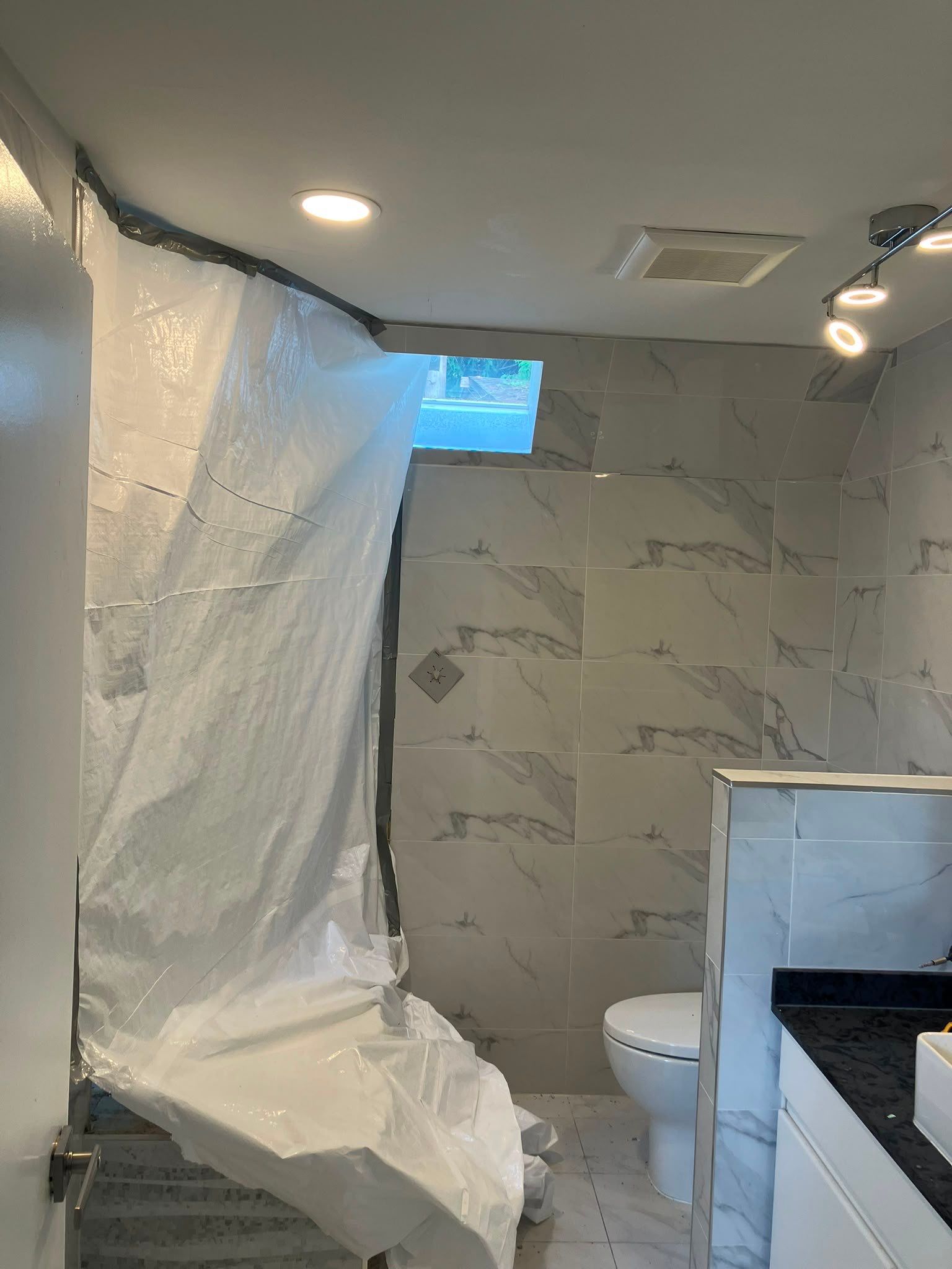 Water Damage Restoration & Bathroom Renovation in West Vancouver by YVR Construction Group