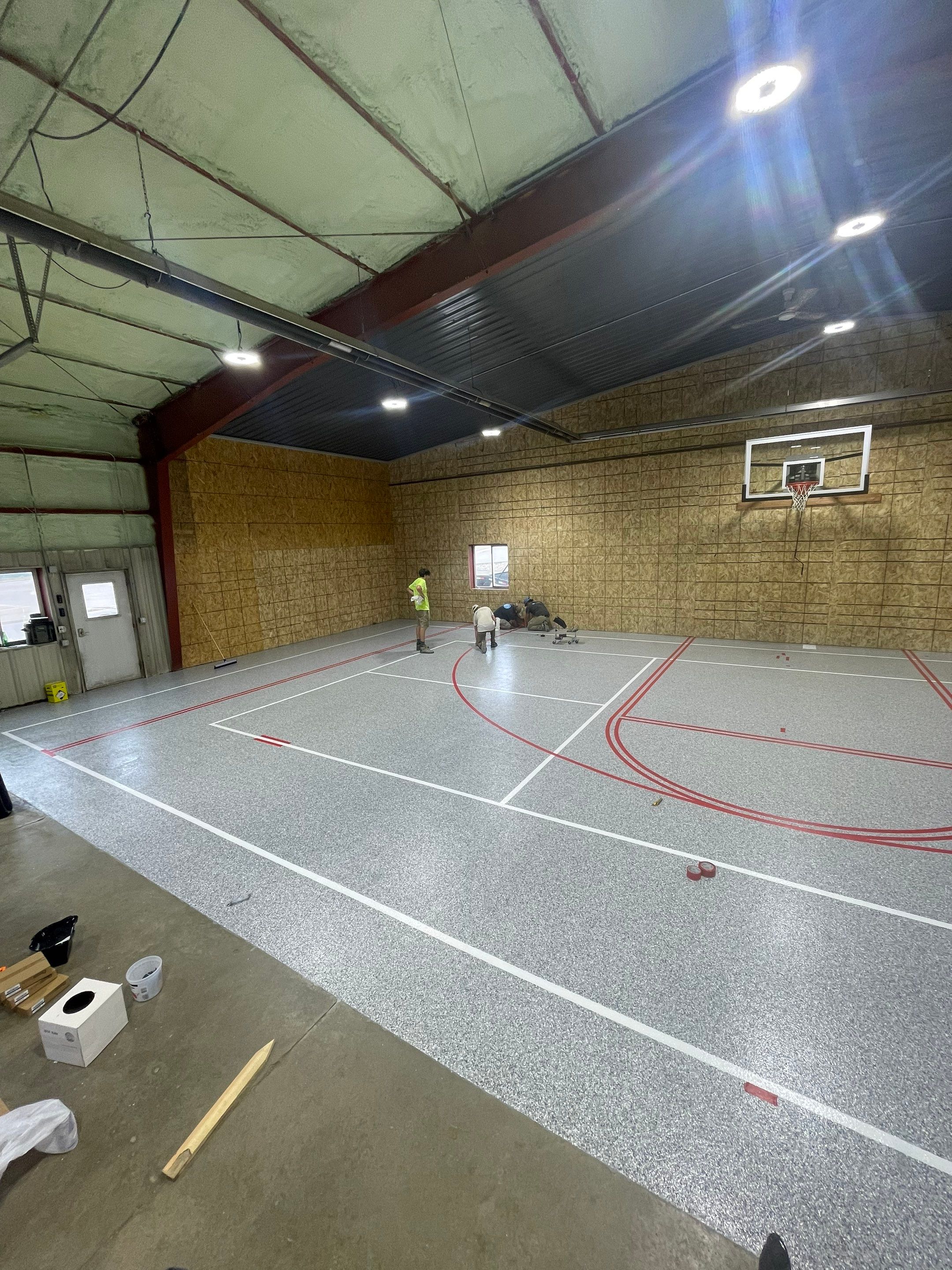 Custom Polyurea Shop Floor with Basketball Court Lines in Rock Valley by Select Painting, Coatings & Garage Cabinets