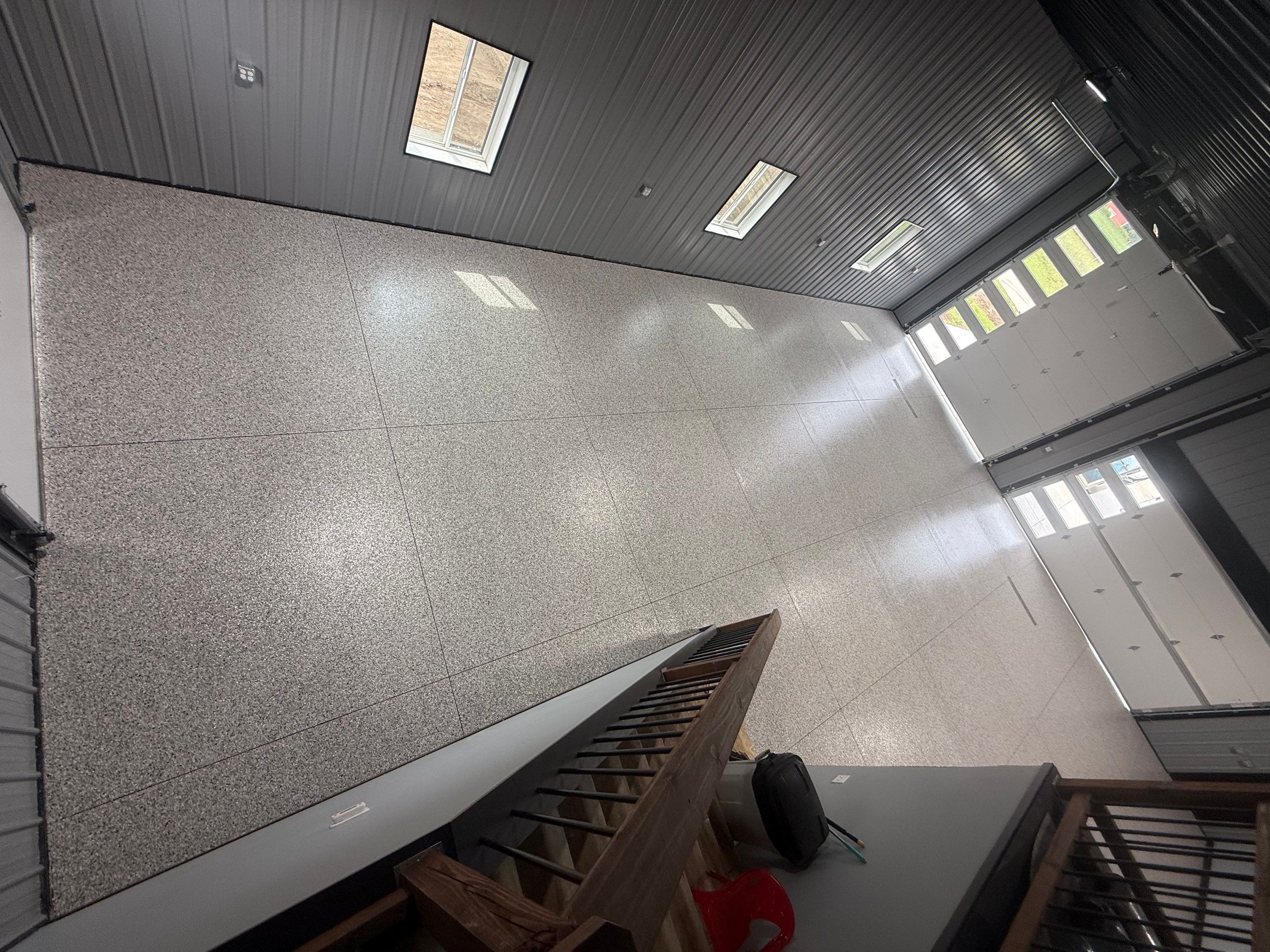 Polyaspartic Garage Floor Coating with Decorative Flake in Wentworth by Select Painting, Coatings & Garage Cabinets
