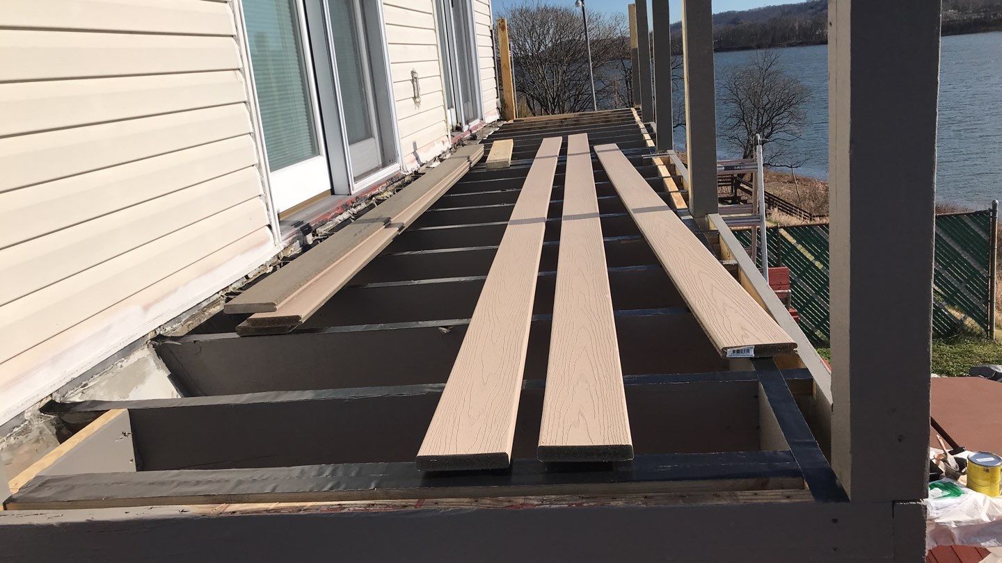 Deck Refurbush and Door Replacement using Trex Decking and Railing. Polaris Patio Doors by Secure Construction Company Inc