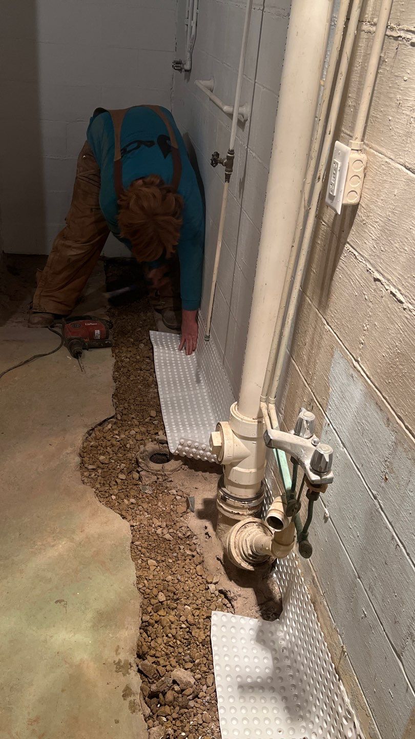 Interior drain tile system installation by ACE Waterproofing & Basement Solutions
