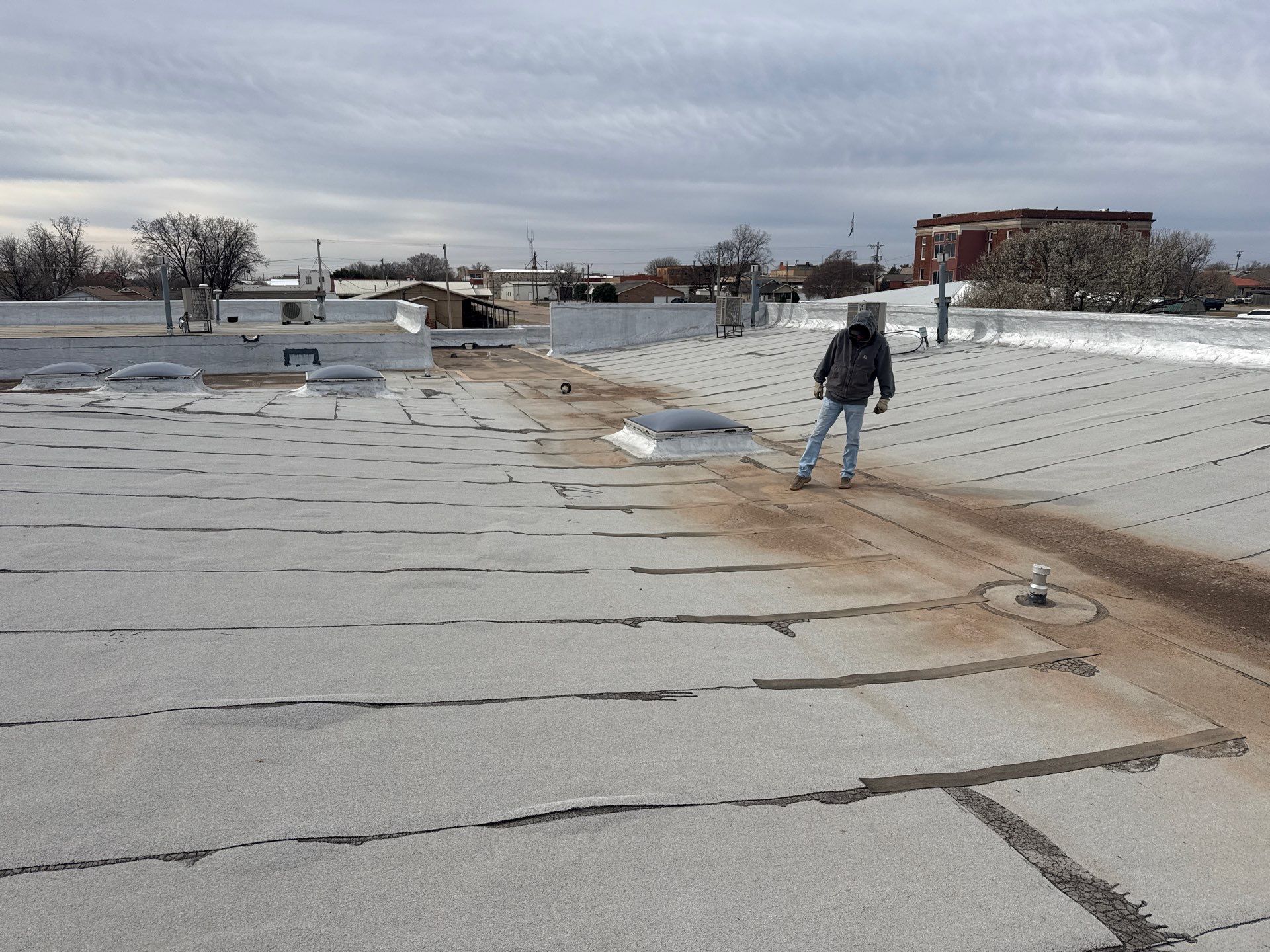 Hollis High School Comprehensive TPO Roof Replacement and Restoration by Secondary Rhodes