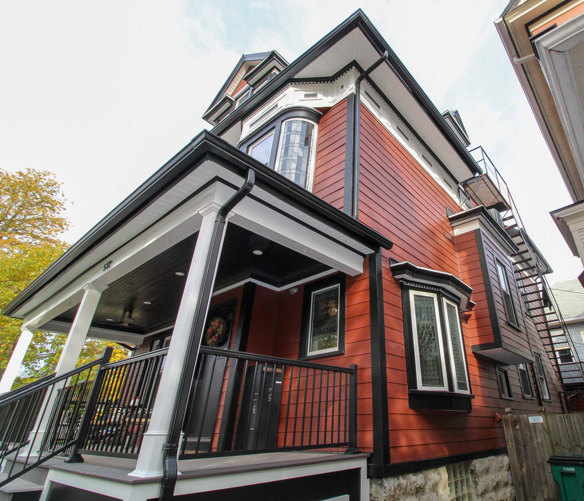 Exterior Renovations- Siding, Stamped Concrete, Porch, and Railings by Ivy Lea Construction