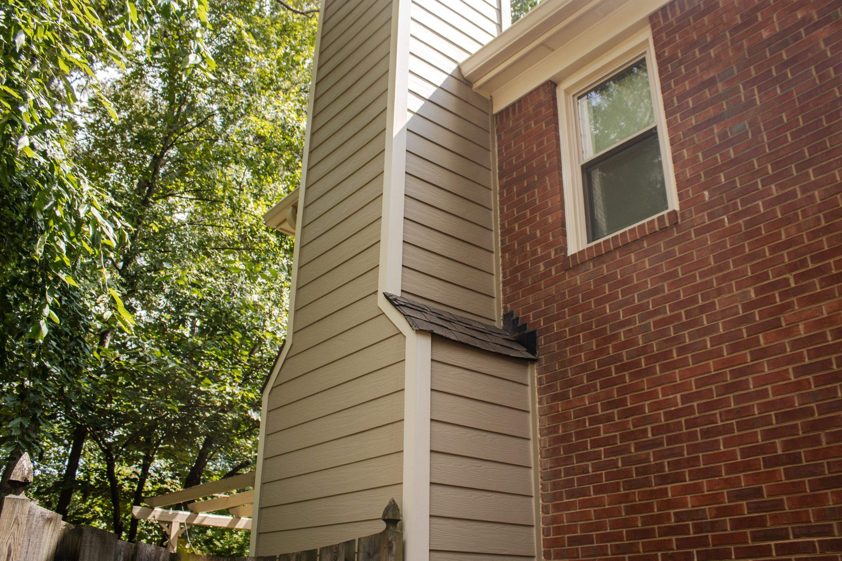 Marietta, GA Rotten Wood Replacement, Chimney Corner Board Installation, Gutter Replacement, and Exterior Painting by Nelson Exteriors