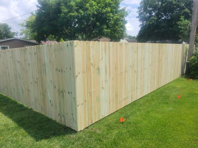 Pressure-Treated Wood Privacy Fence Installation in Charles City
