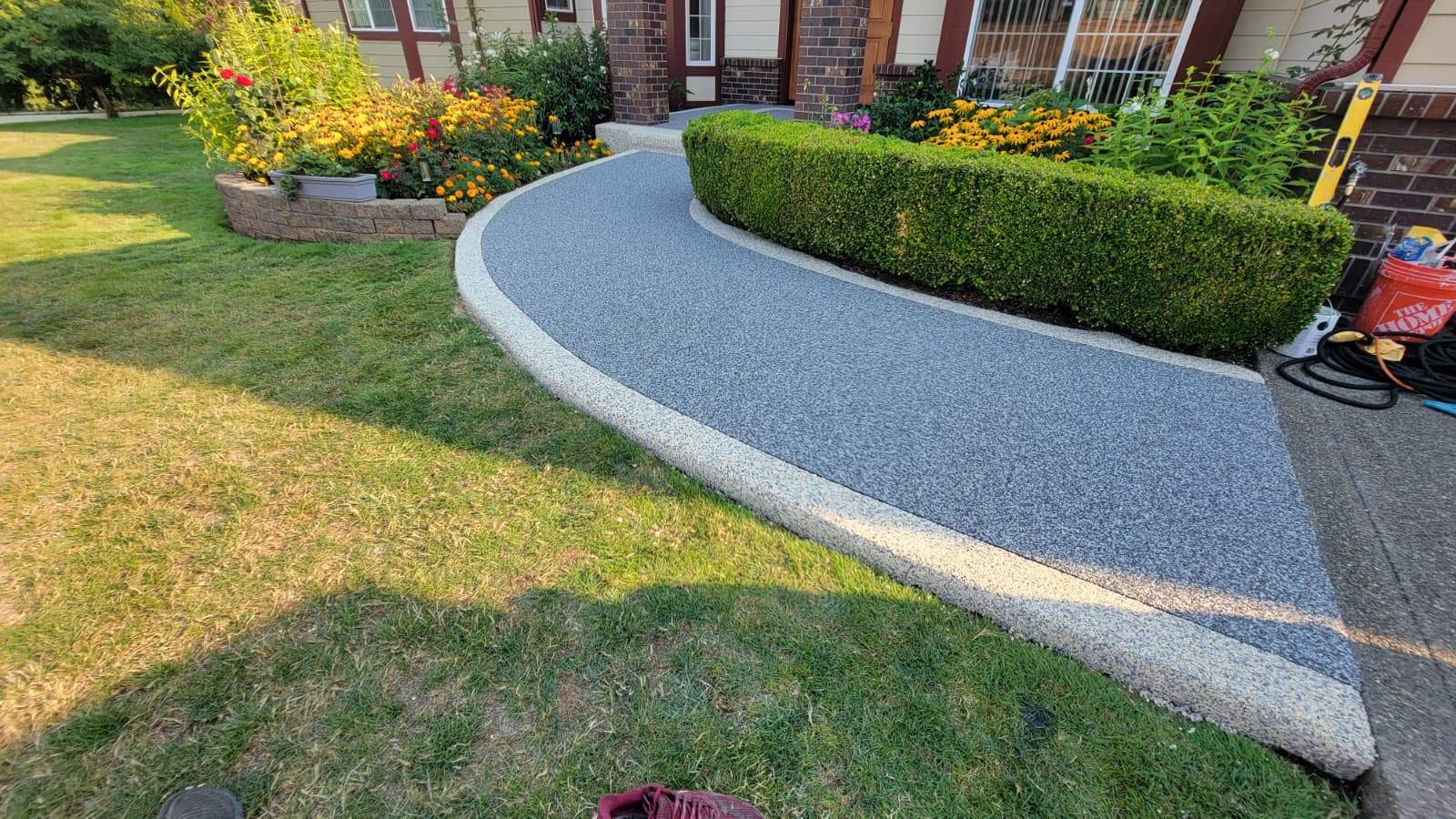 Elegant Walkway and Patio in Palazzo and Santorini Vuba Stone by Concrete Coating Experts Inc.