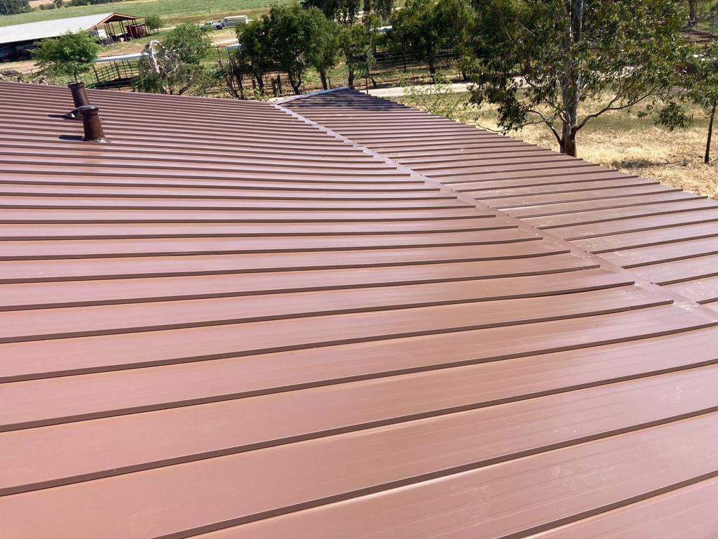Metal roofing installation using Standing seam metal roofing system by Straight Edge Roofing Inc