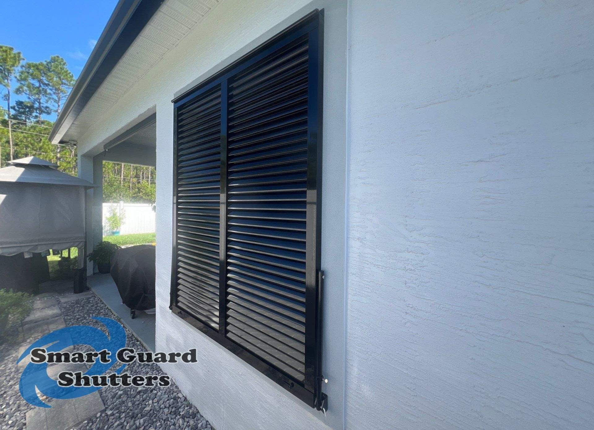 Impact Bahama Shutters in Jet Black by Smart Guard Shutters