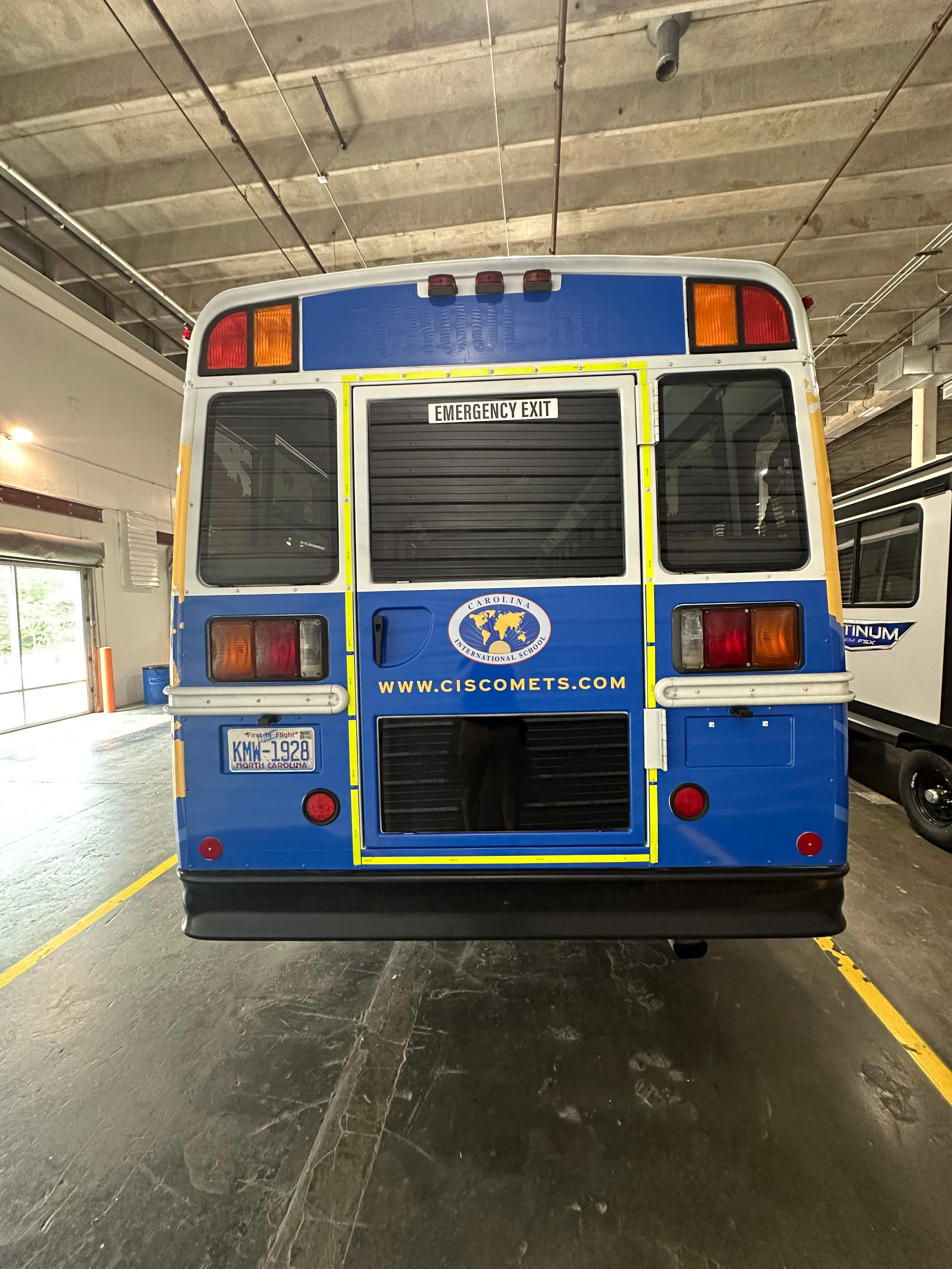 Carolina International School - Bus Vinyl Wrap by QC Signs and Graphics