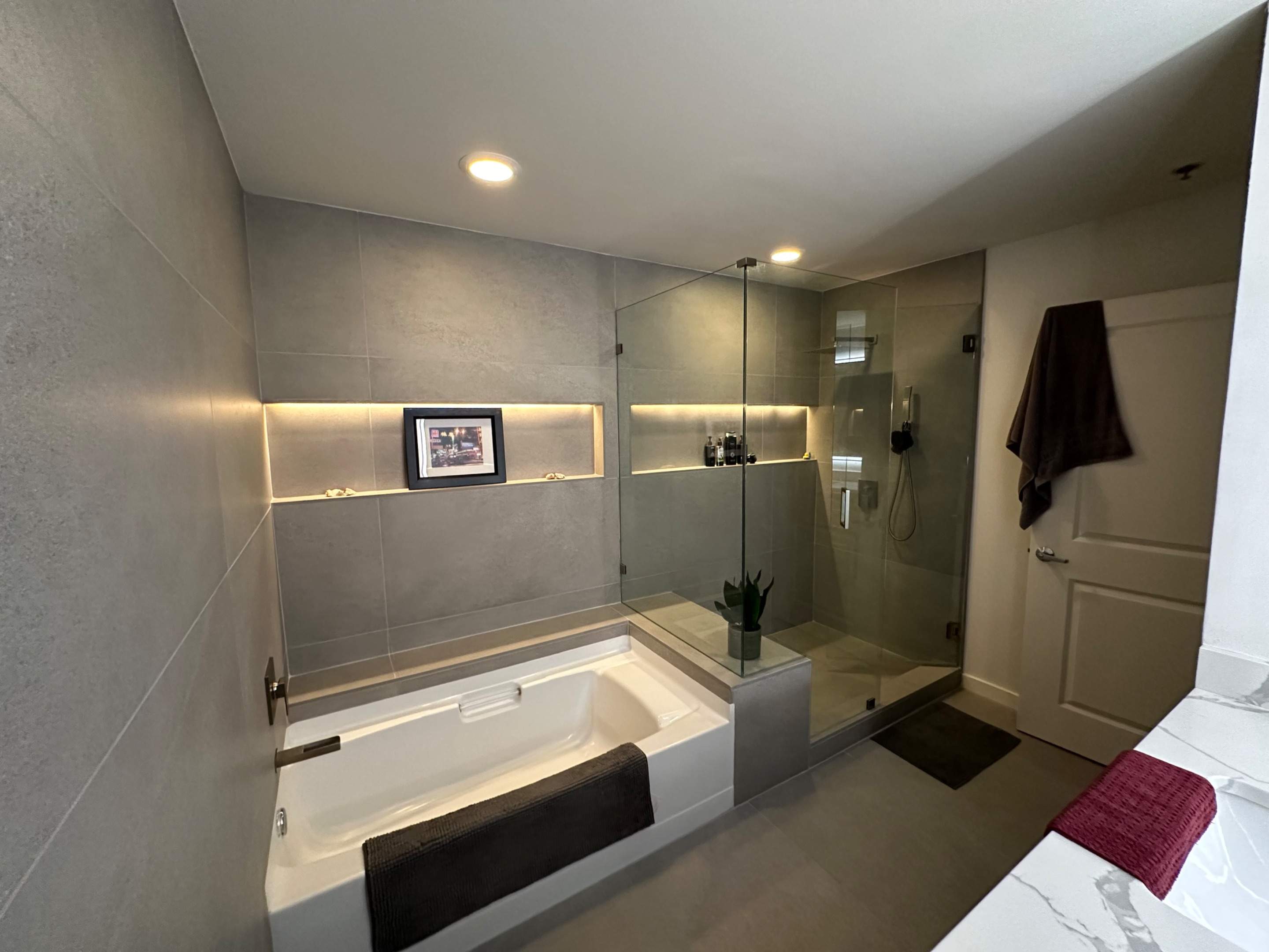 Modern Bathroom Transformation by Fine Line Flooring Inc.