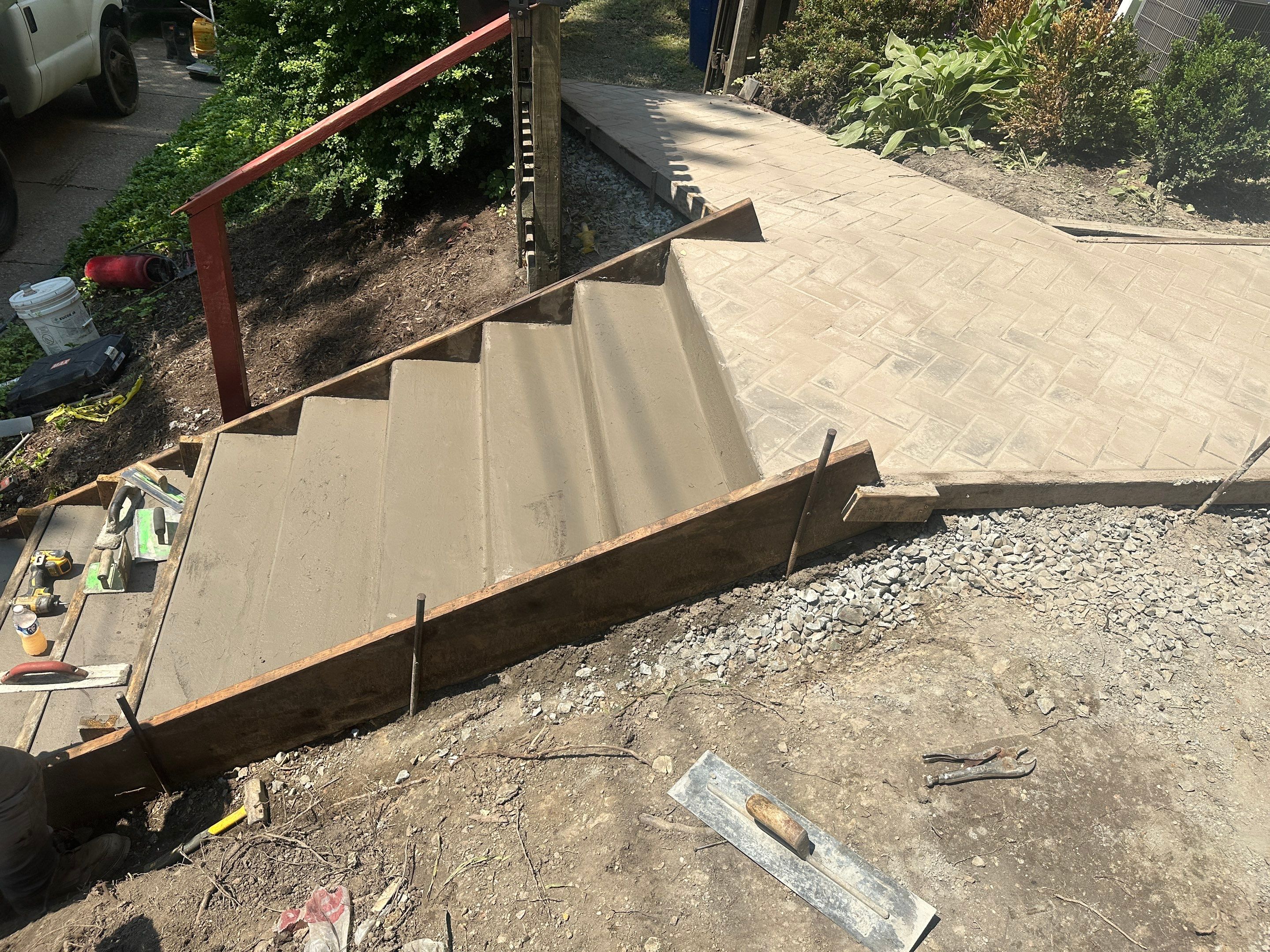 Stamped Concrete and Retaining Wall by Cousins Roofing Siding & Decks