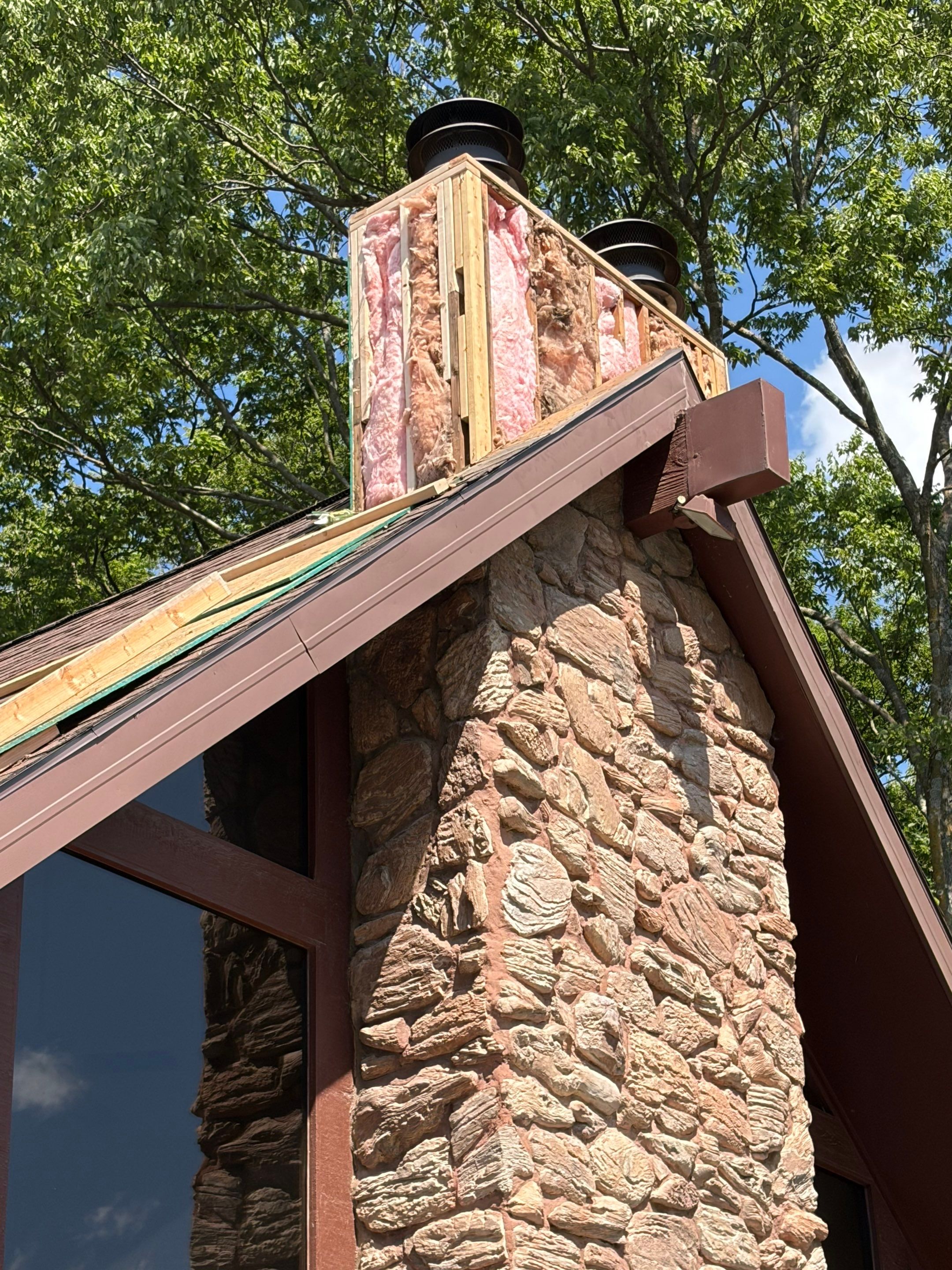 Structural Stone Chimney Restoration and Roof Repair in Leavenworth by Summit Roofing
