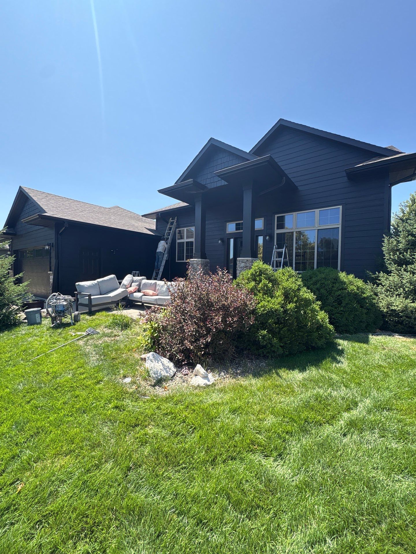 Full Exterior Siding Repaint for Sioux Falls Home and Garage by Select Painting, Coatings & Garage Cabinets
