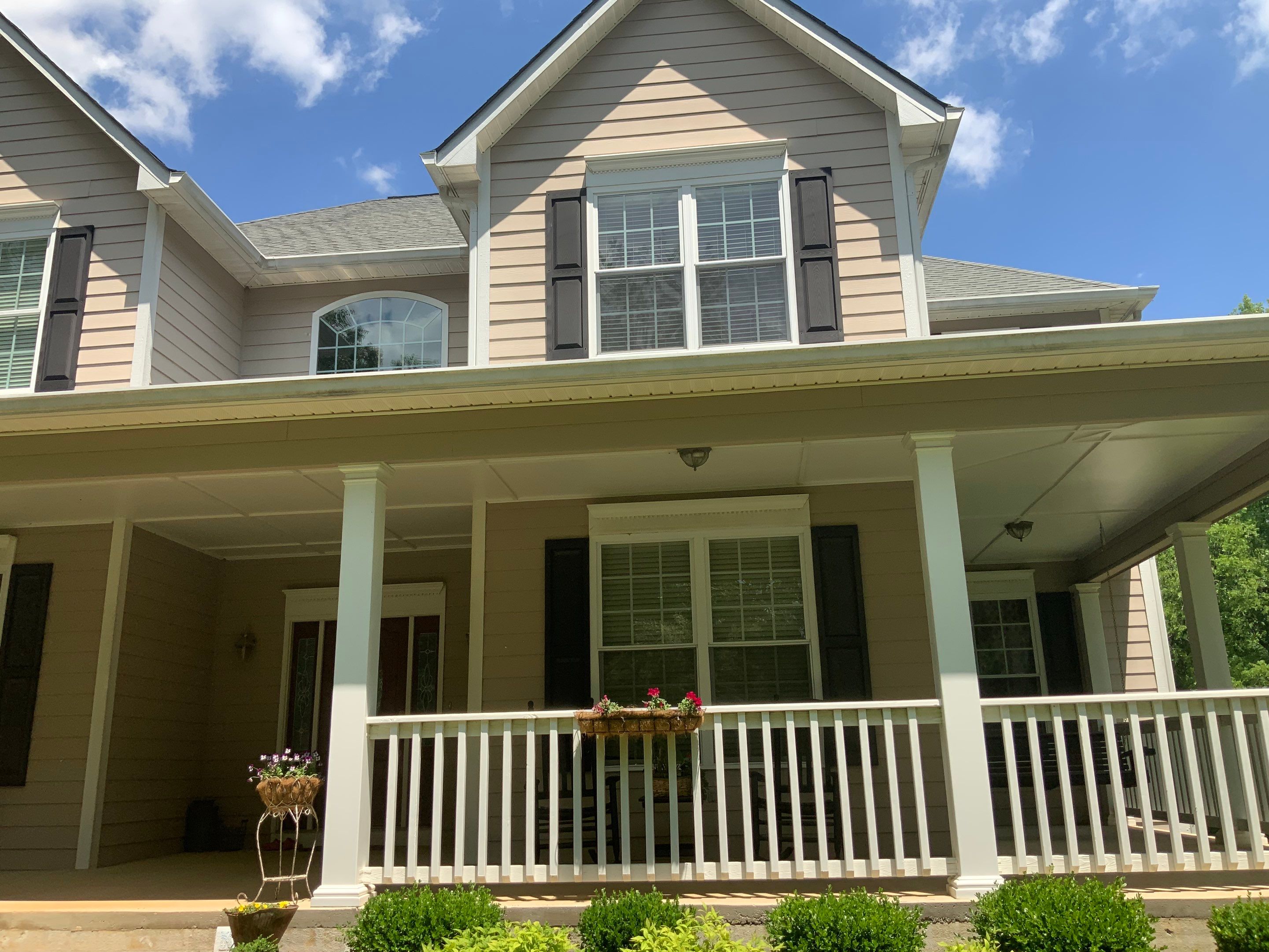 Siding replacement, exterior painting, and front door staining. by GonzalezPainters & Contractors Inc