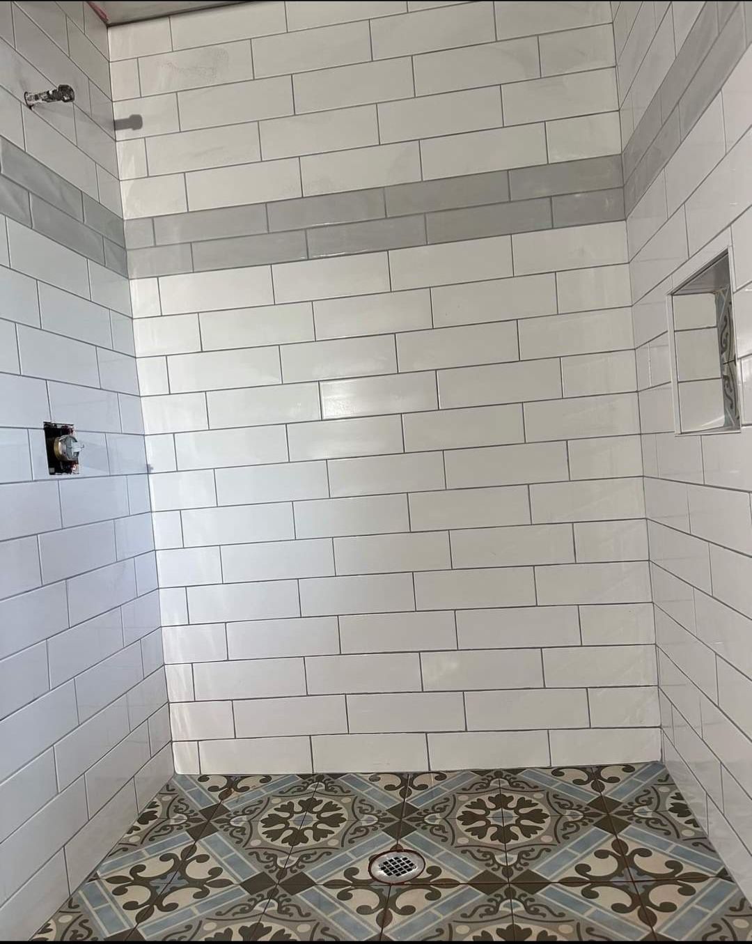 Jack & Jill Bathroom Floor + Dog Washing Nook with Niche using Porceline Subway Tile by Footprints Floors Morristown