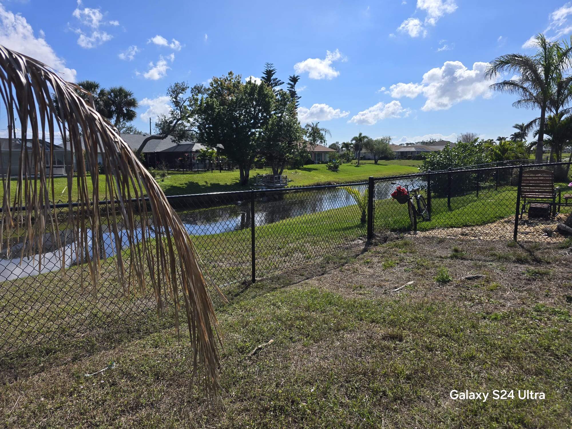 Waterfront Black Chain Link Fence Installation in Rotonda West by True Fence LLC