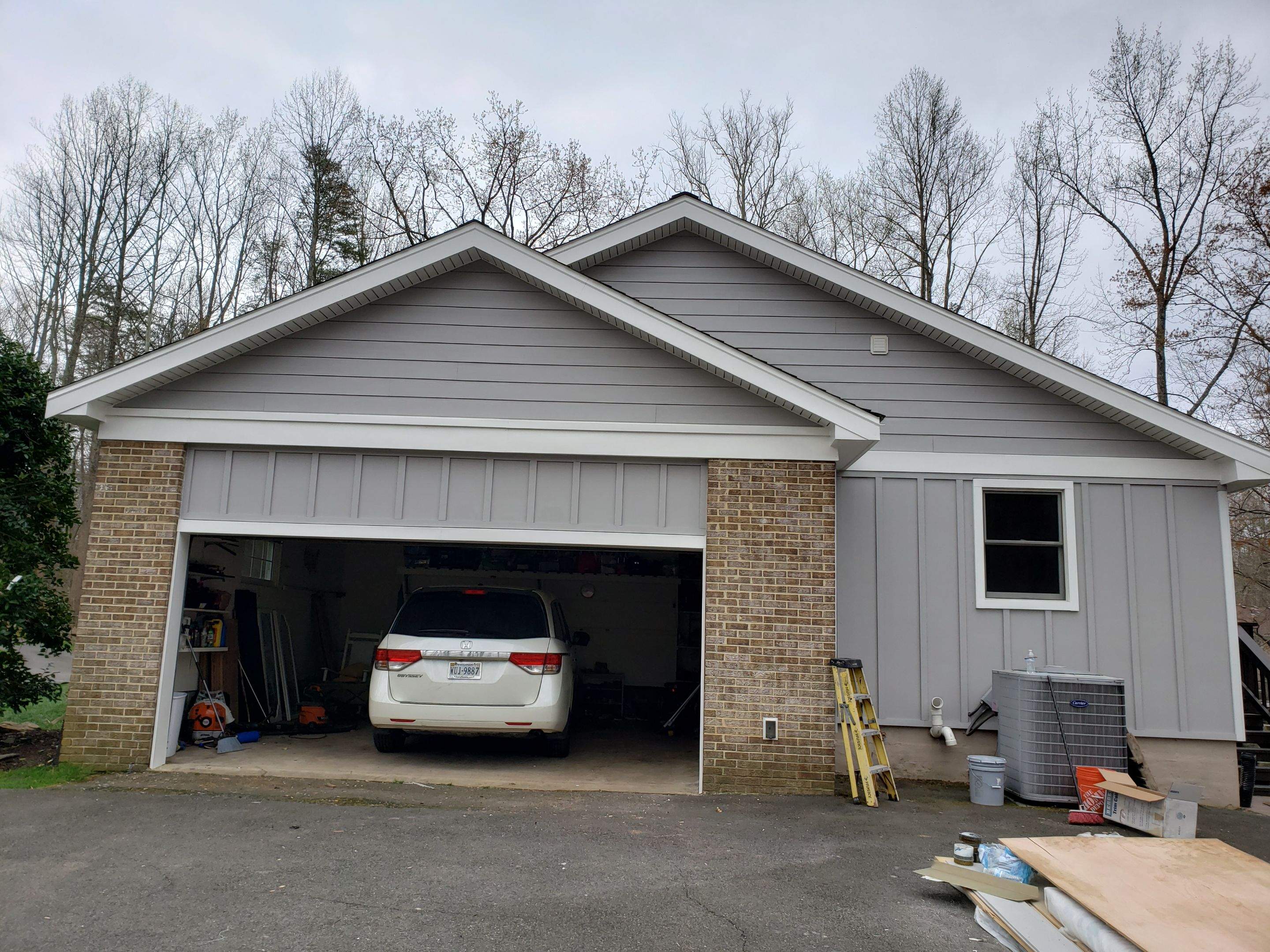 Roof, Siding, Door, and gutter replacement by American Home Contractors