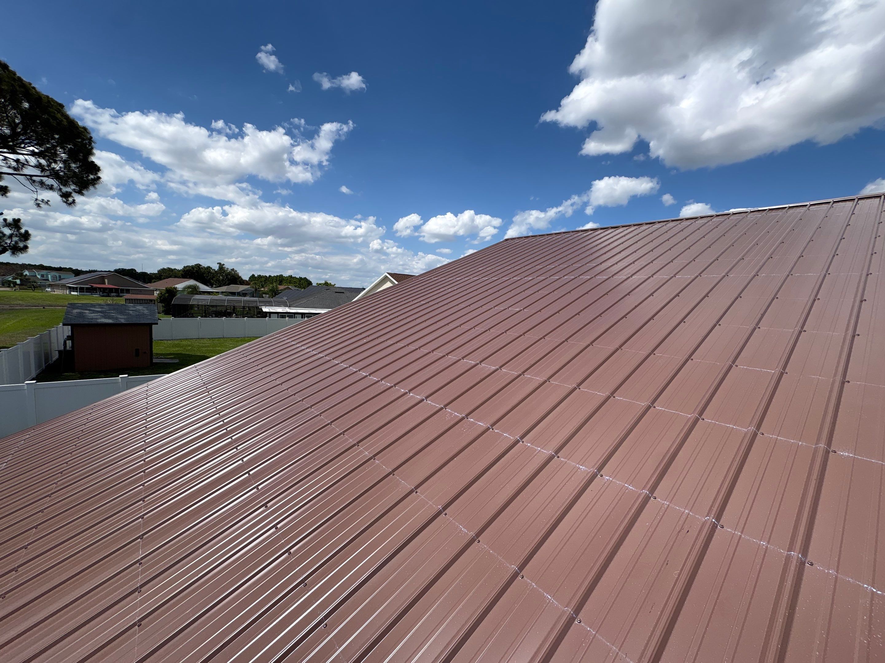 Residential Metal Roofing Installation and Gutter Replacement in Kissimmee by Pinnacle Roofing Group
