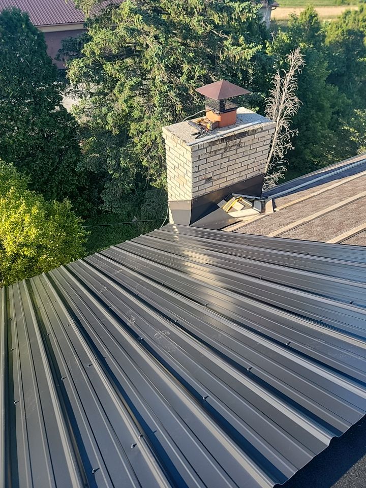  Metal Roof Installation on Residential Brick Home in Oostburg, WI by Gellings Roofing and Siding LLC