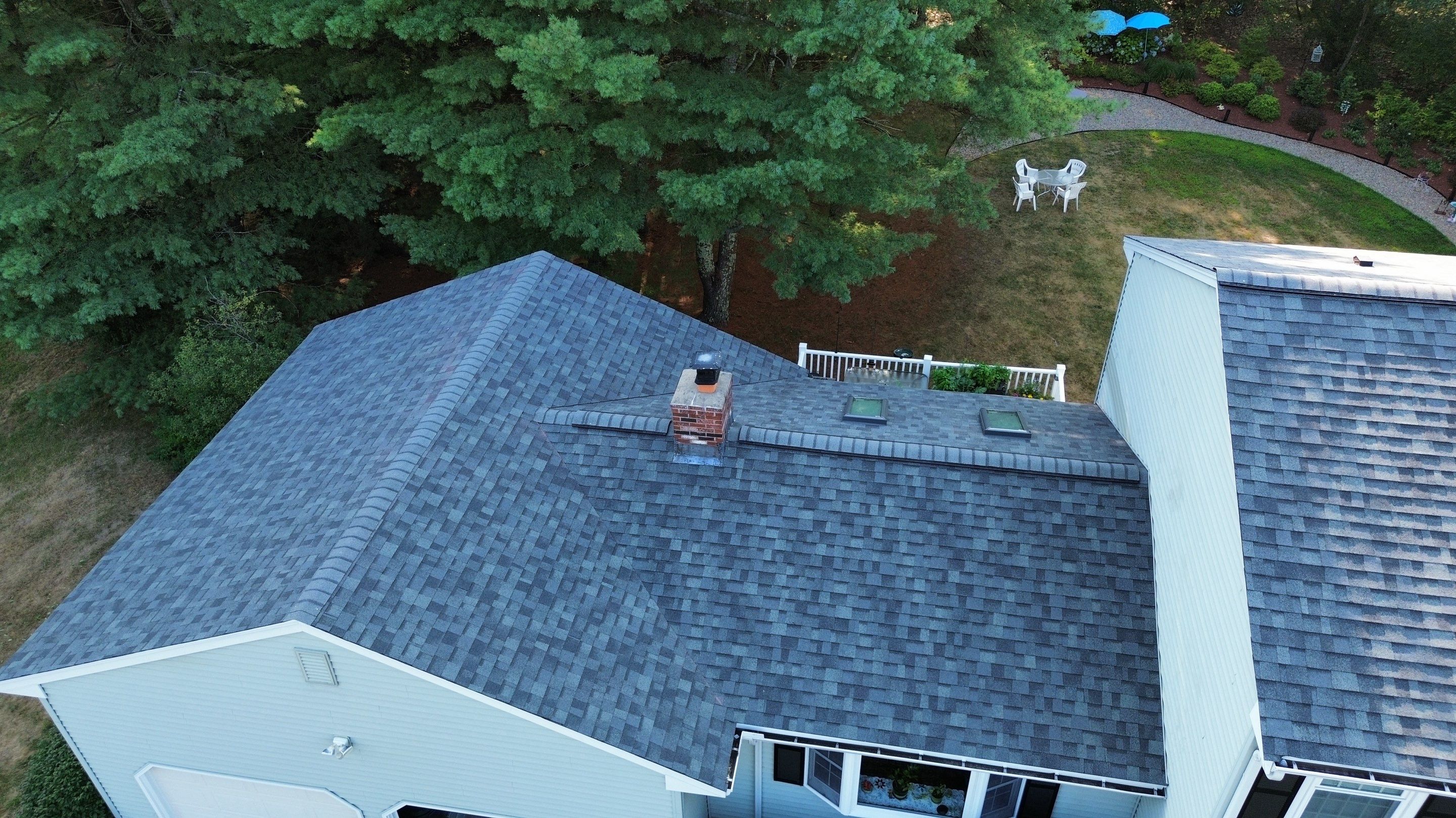 Complete Roof Replacement with Chimney Flashing, Gutter Guard System, and Vinyl Siding Repairs by Mighty Dog Roofing of Greater Middlesex County