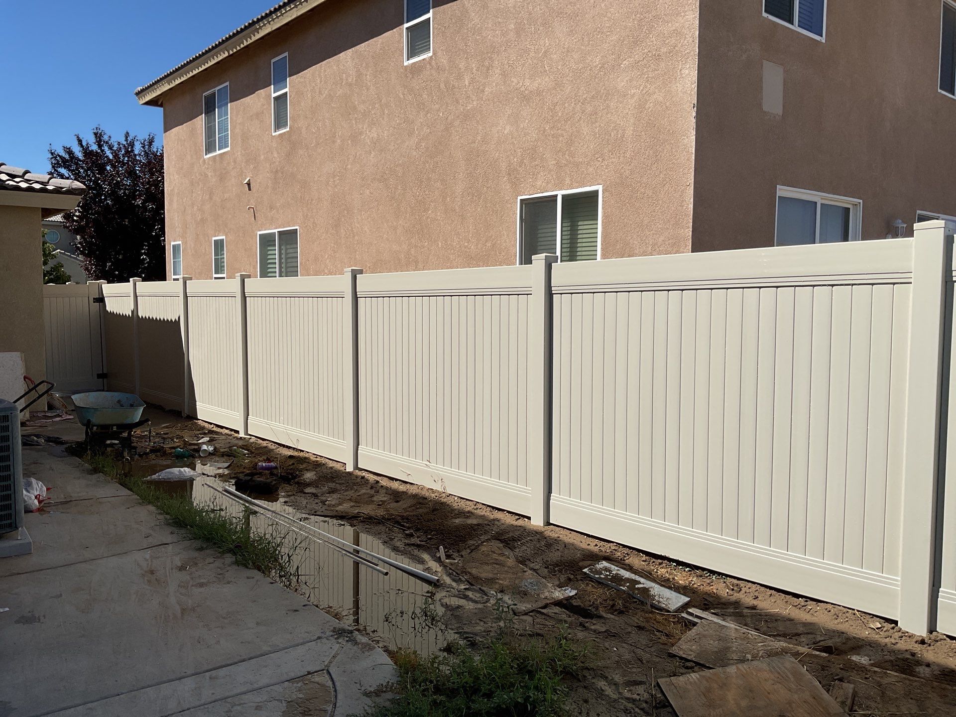 Tan Vinyl by Fence Guys Inc. 
