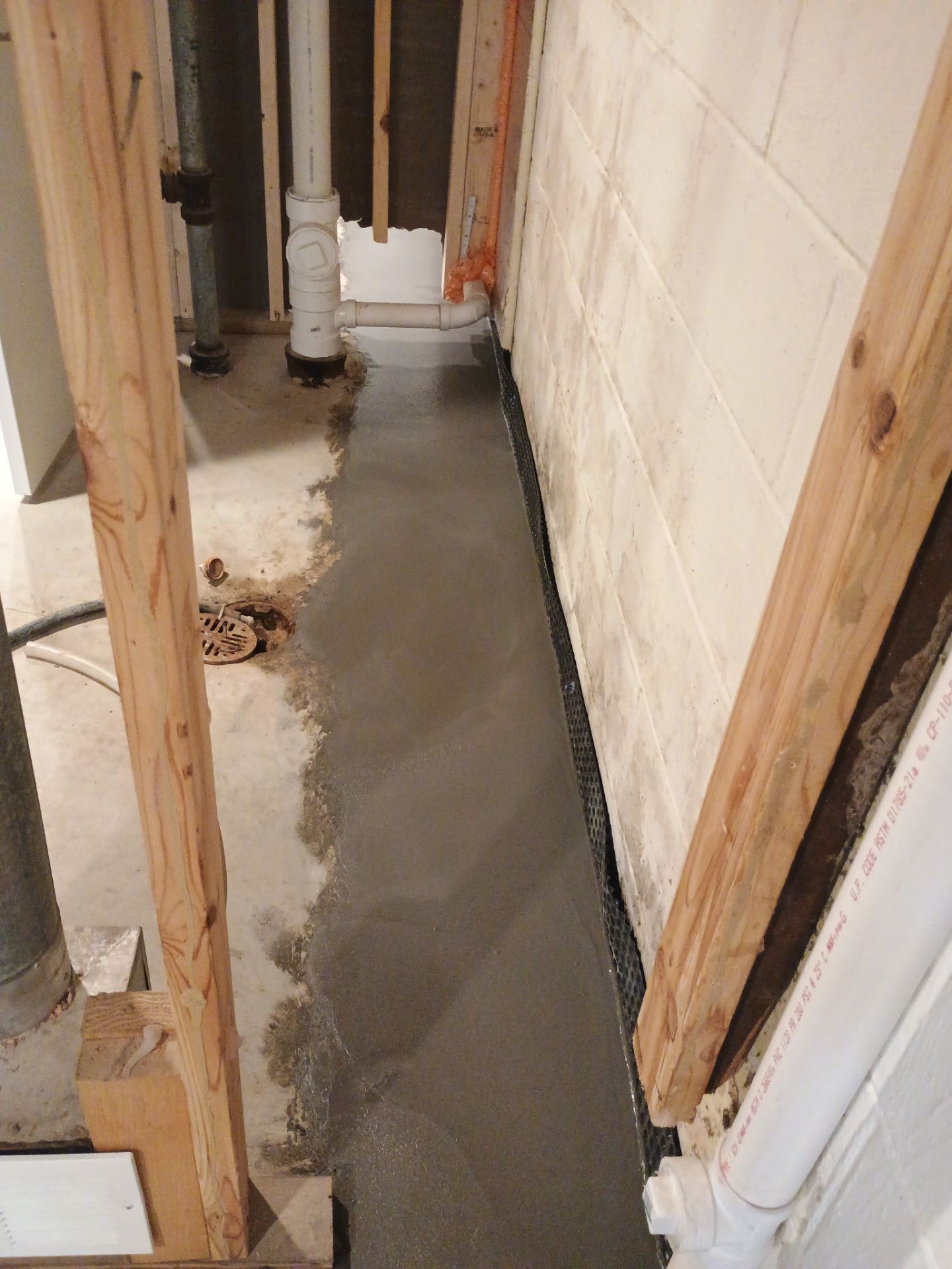Interior Drain Tile & Buried Discharge in St. Anthony, MN by Waterproofing Northeast