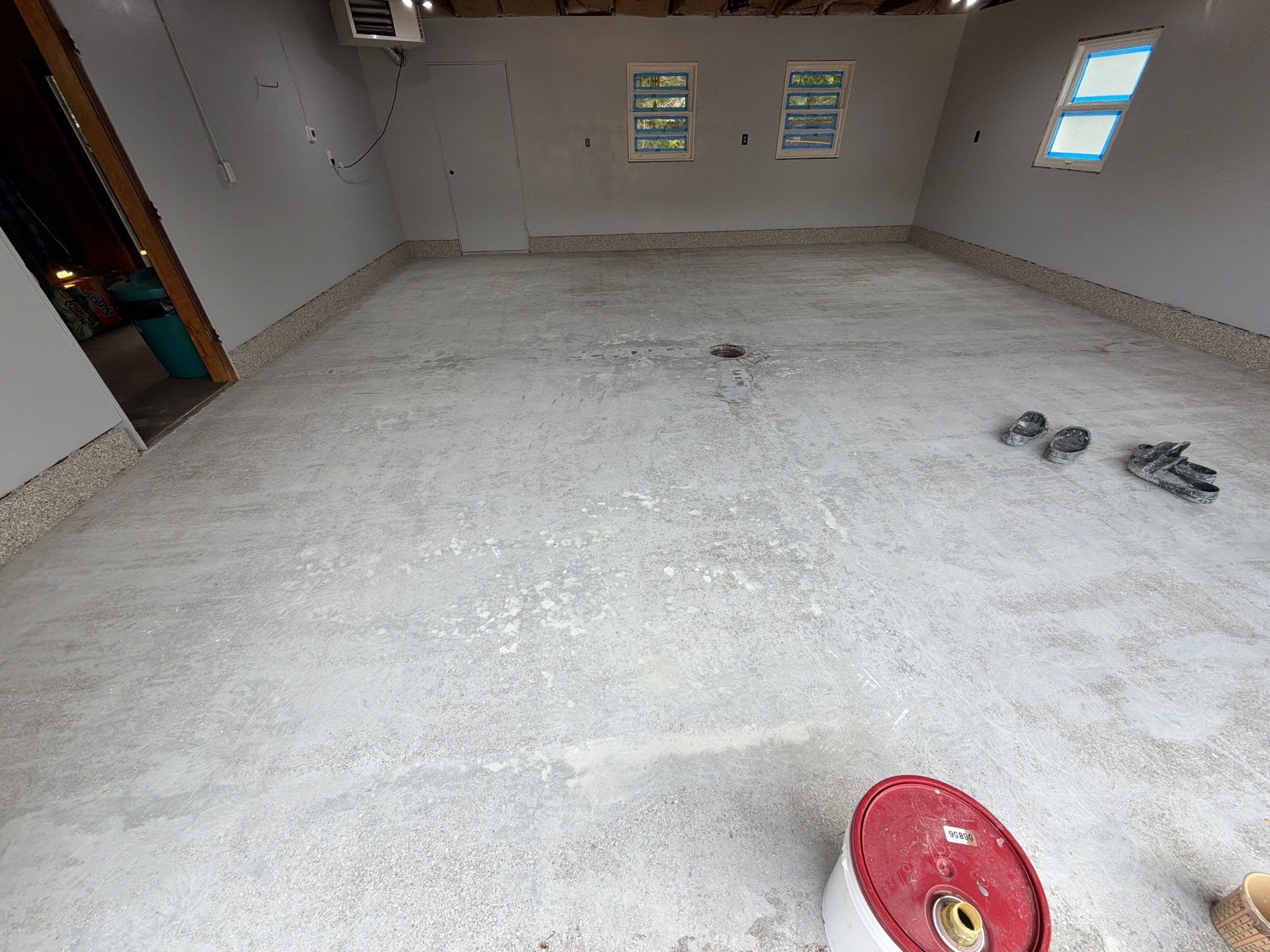 Garage Epoxy Flake Floor Installation and Exterior Siding Repairs in Muskegon by Gordon Painting
