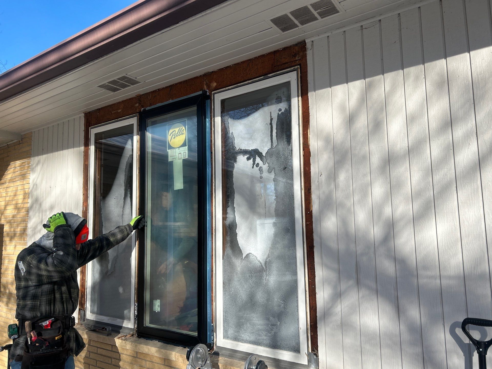 Black-Frame Pella Lifestyle Upgrade on a Partial Brick Home by United Windows and Siding LLC