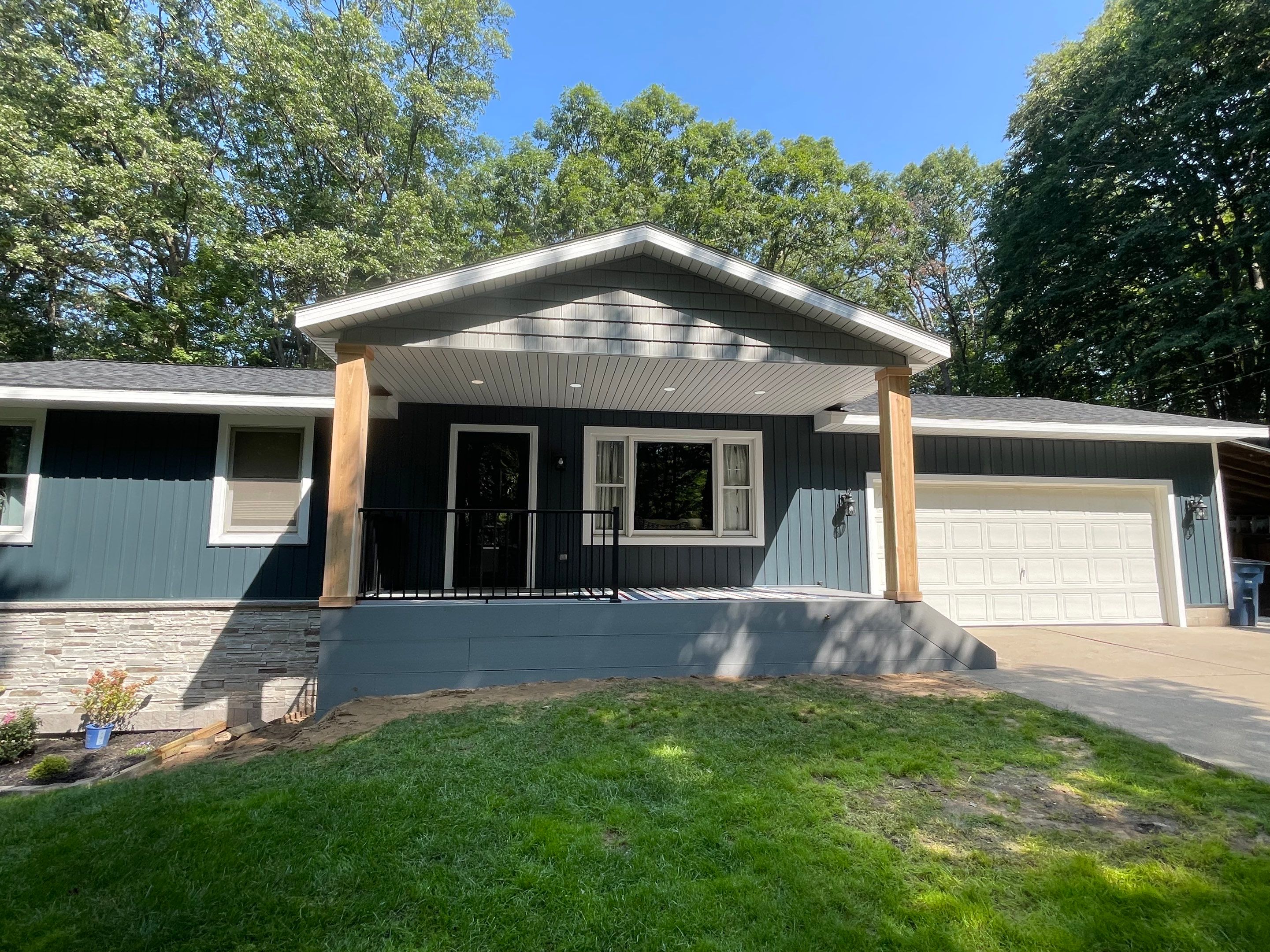 Siding, Deck and Versetta Stone by Avalon Roofing and Exteriors