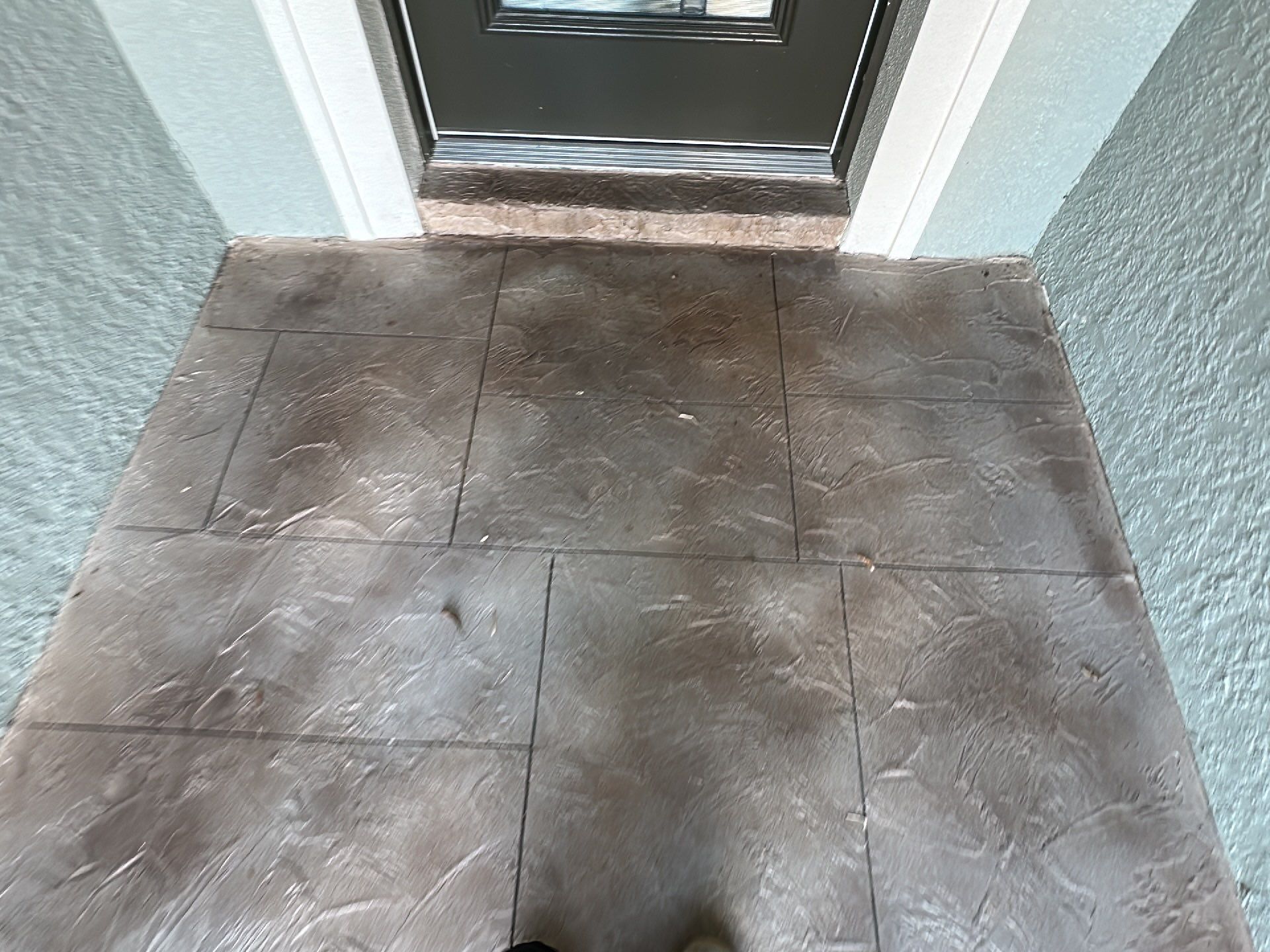 Driveway and Sidewalk in Slatestone with Silvercreek Border by Innovative Concrete Coatings 