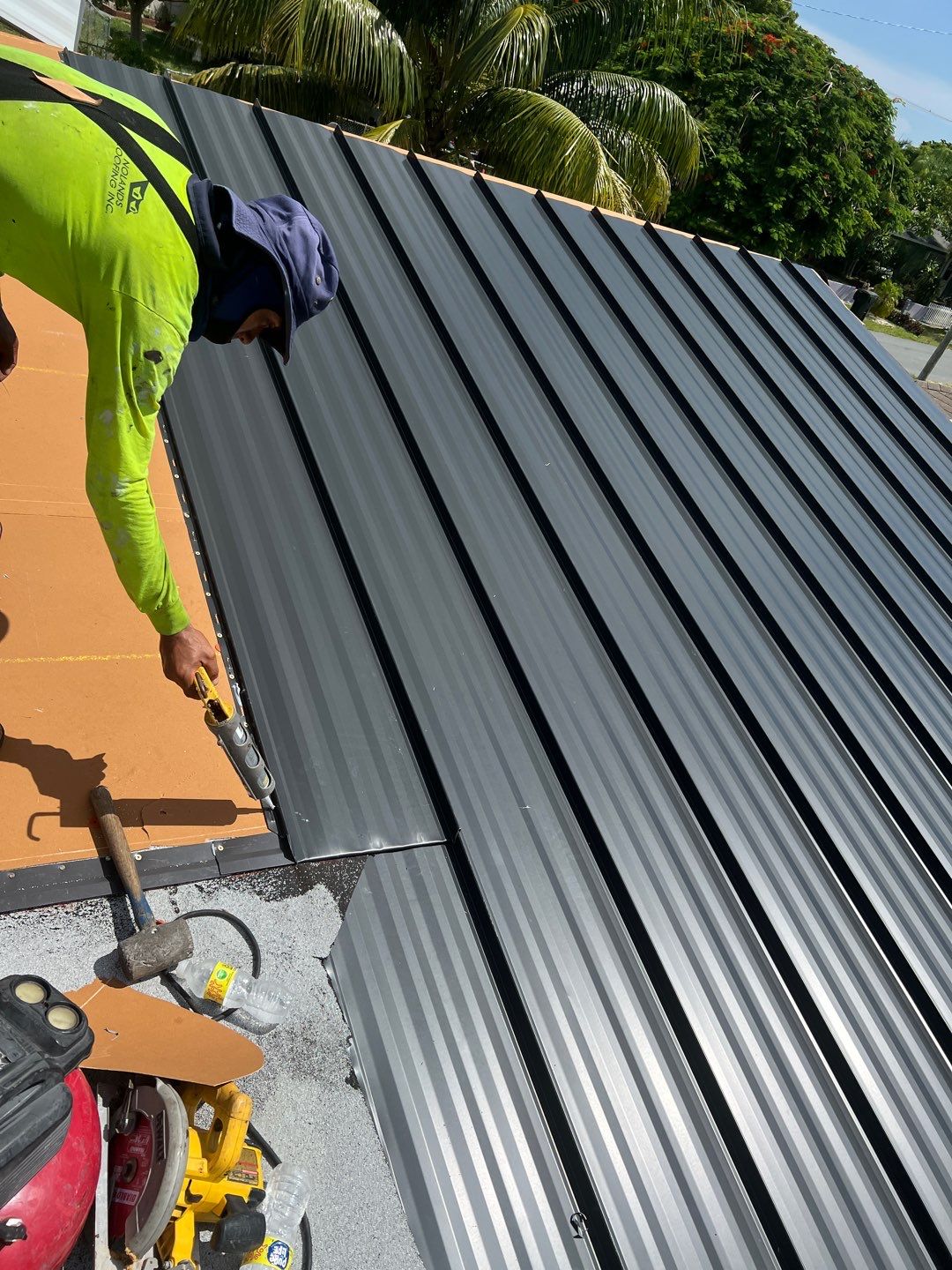 Standing Seam Metal & Flat Re-Roof using 1.5" Nail Strip 24ga Black Matte Kynar Coated Standing Seam Metal Panels by Morton Roofing, Inc.