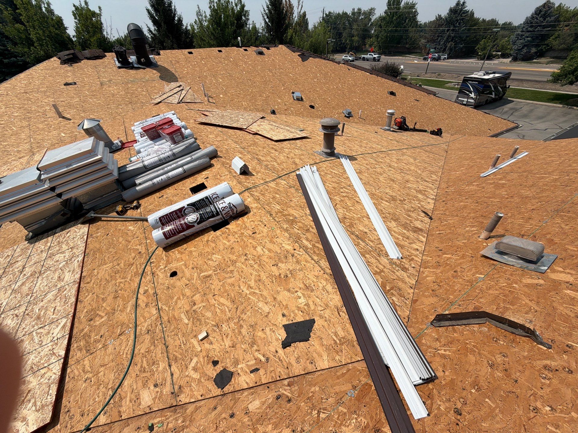 Boise Commercial Roof Replacement with Brown Architectural Shingles by Olive Roofing