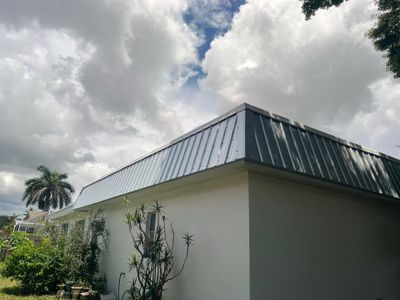 Residential Roofing Installation using TPO Roofing System & Tuff Rib Metal 