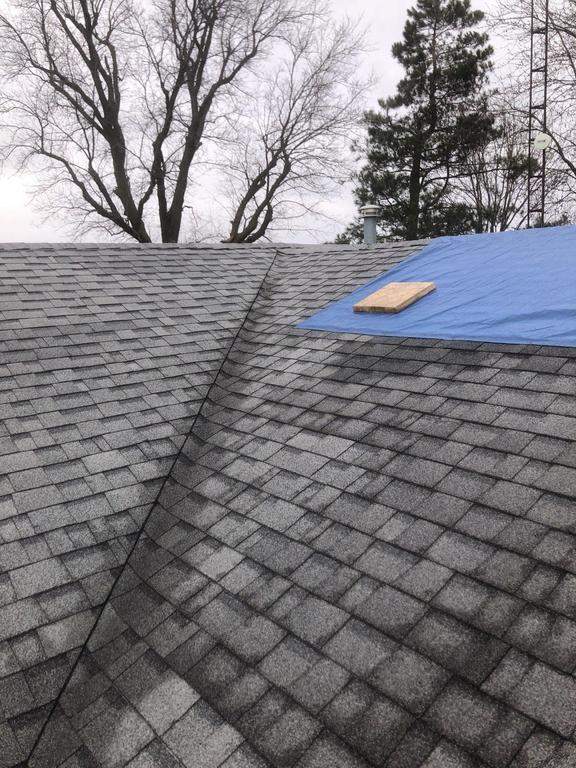 Storm damage roof replacement by Nitro Roofing and Construction