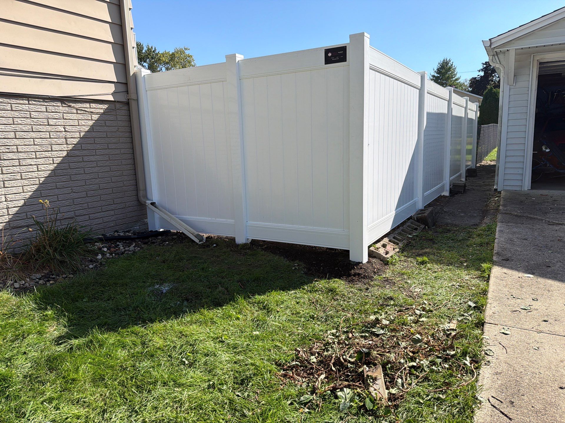 Custom Vinyl Privacy and Black Chain Link Fence Installation in Cedar Falls by Perfect Picket Fence and Stain