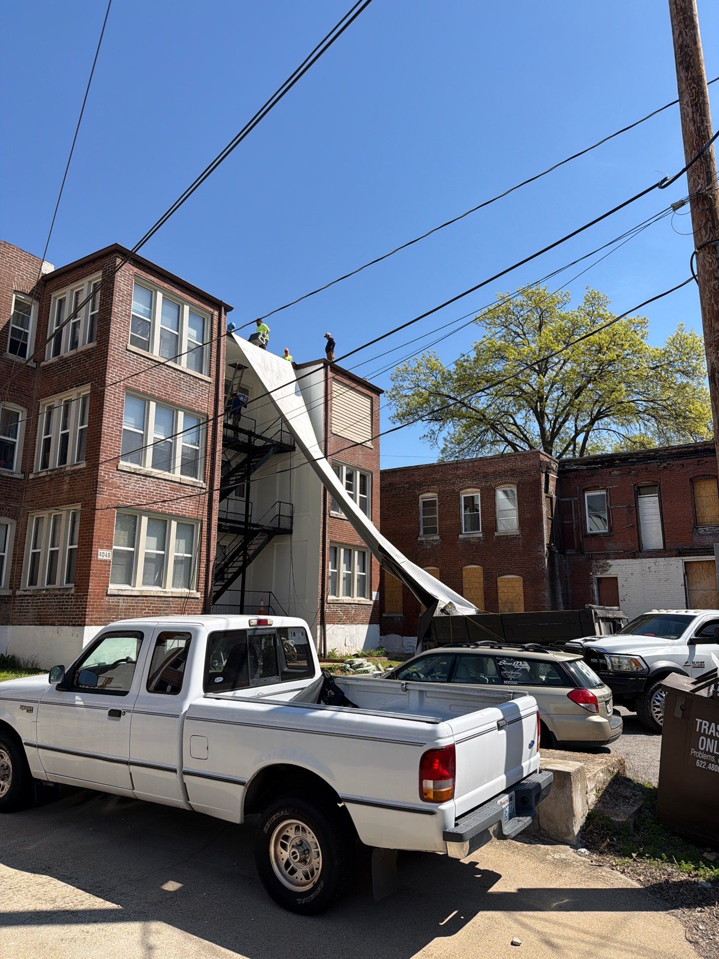 Multi-Family TPO Roof Installation and Masonry Repair in St. Louis by Acute Roofing And Exteriors