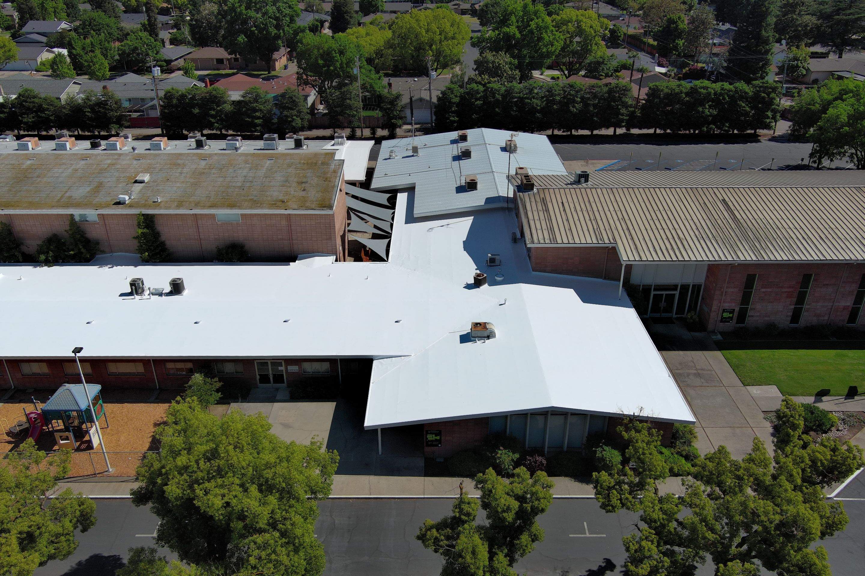 Single-ply restoration system using Benchmark/PUMA XL coatings over TPO single-ply roofing by Straight Edge Roofing Inc