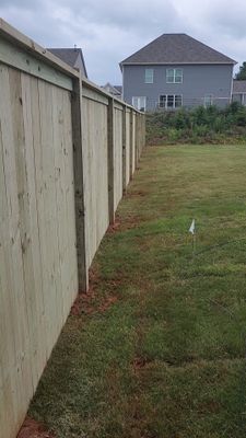 Fence Installation of Capped Wood Privacy