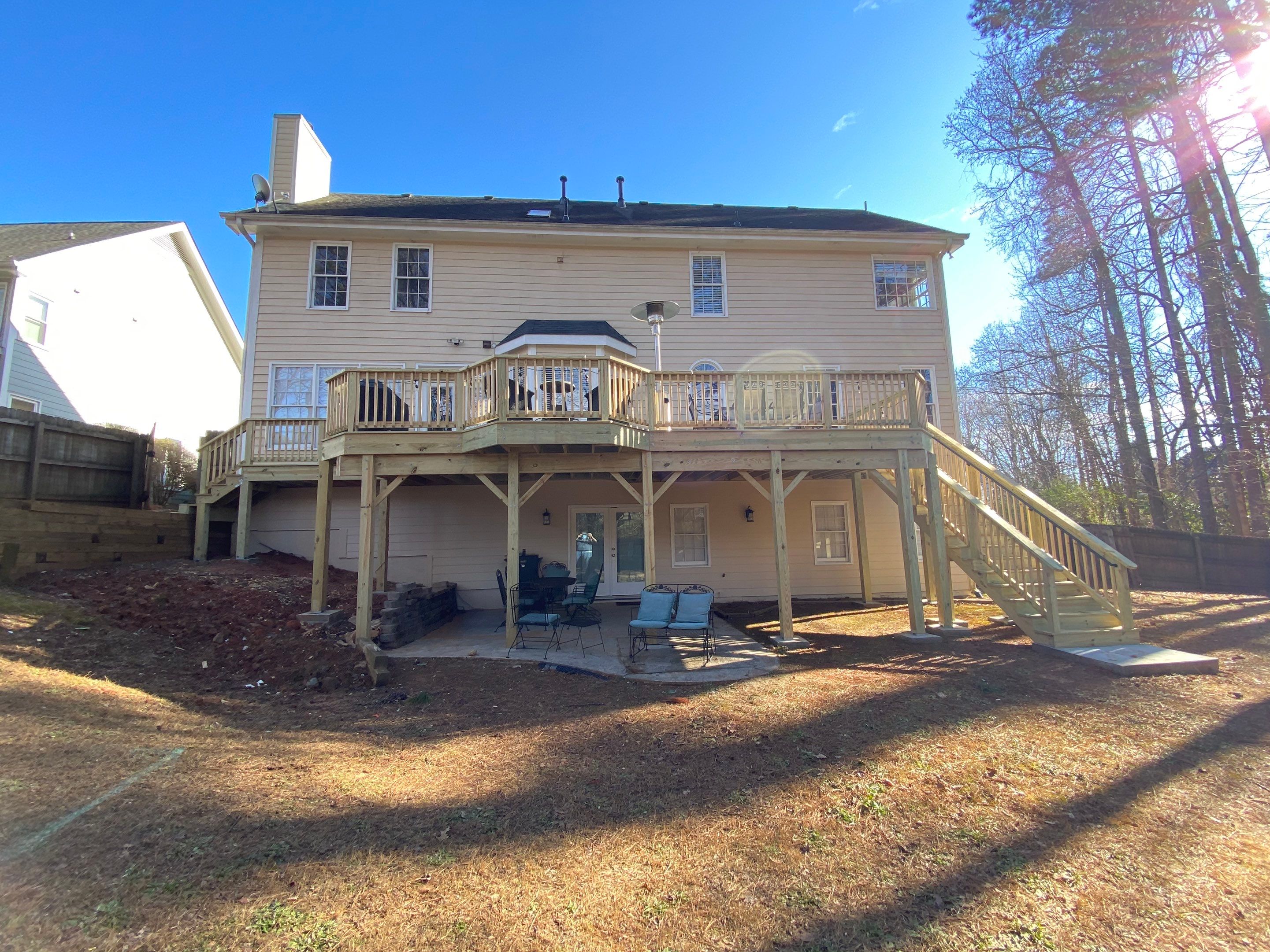 Elevated Pressure-Treated Wood Deck Replacement and Staircase in Duluth by Swift Home Renovations