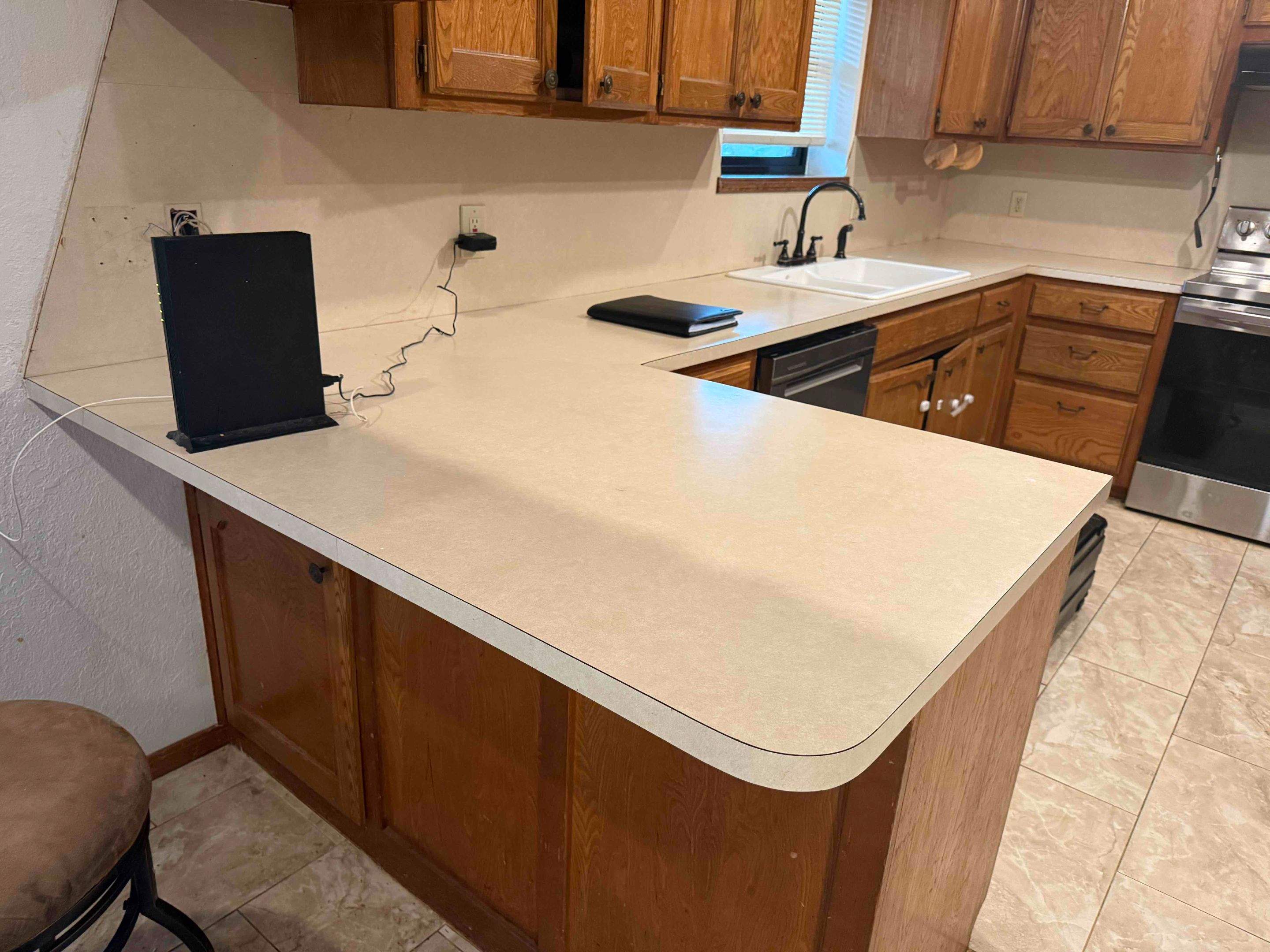 Granite Countertop and Full-Height Backsplash Installation in Washington by TNT Countertops