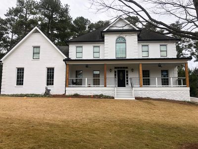 Custom Front Porch Construction with White Railing in Dunwoody