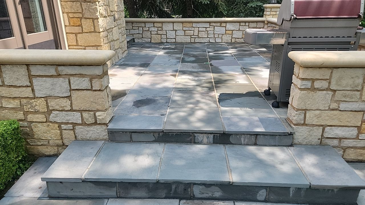 Northbrook, IL stucco home soft wash and stone cleaning by Northern Power Washing LLC.