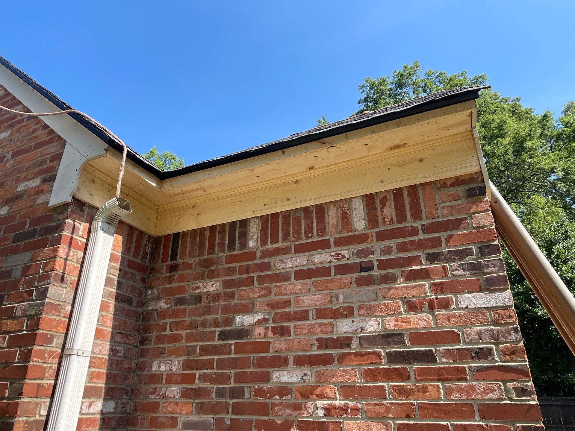 Full Roof Replacement with gutter upgrade after tree impact damage in East Memphis by Revival Roofing Services