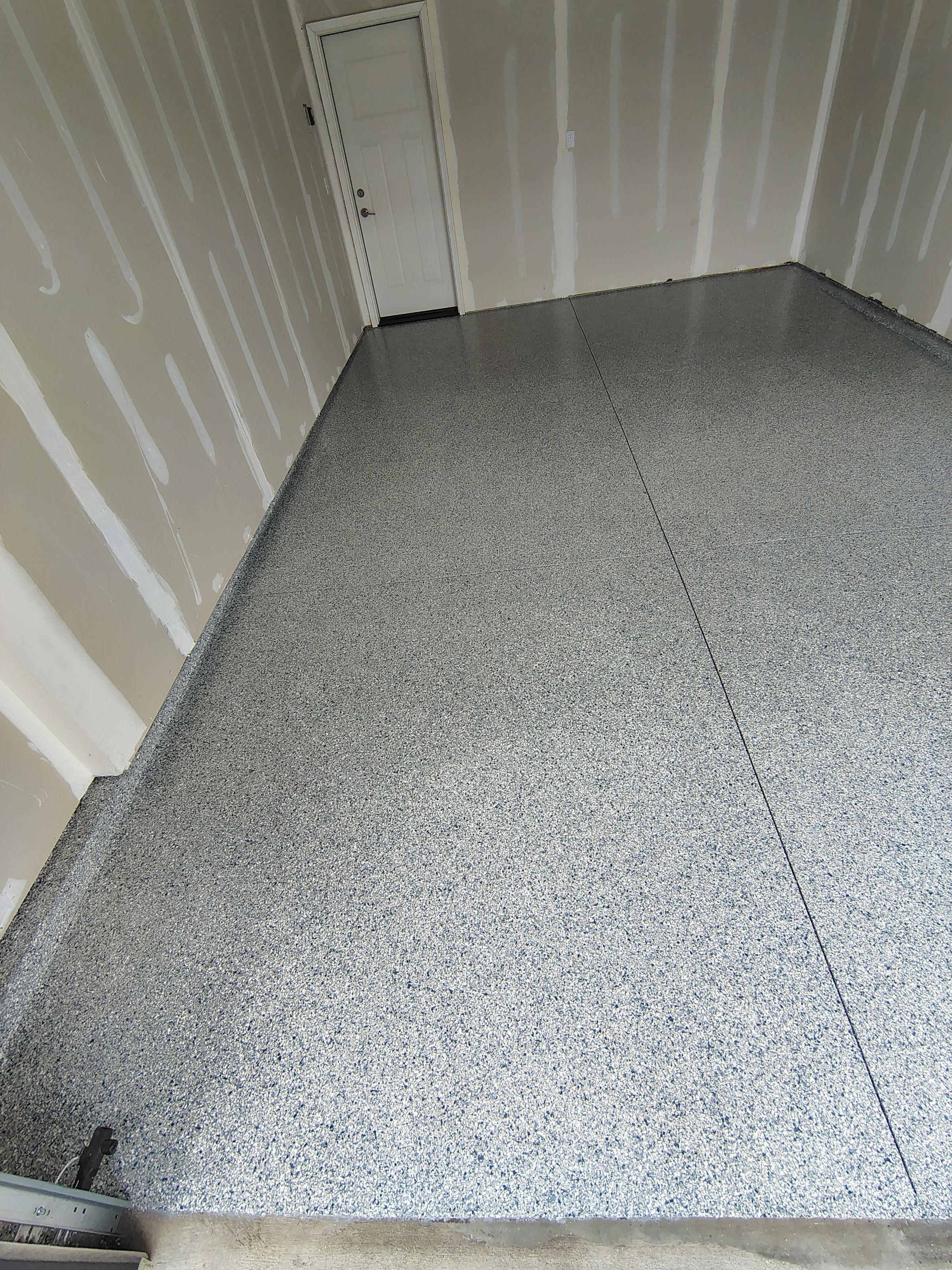 Custom Epoxy Garage Floor Coating Installation in Sioux Falls by Select Painting, Coatings & Garage Cabinets