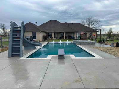 Geometric Pool with Beach Entry, Slide and Raised Spa