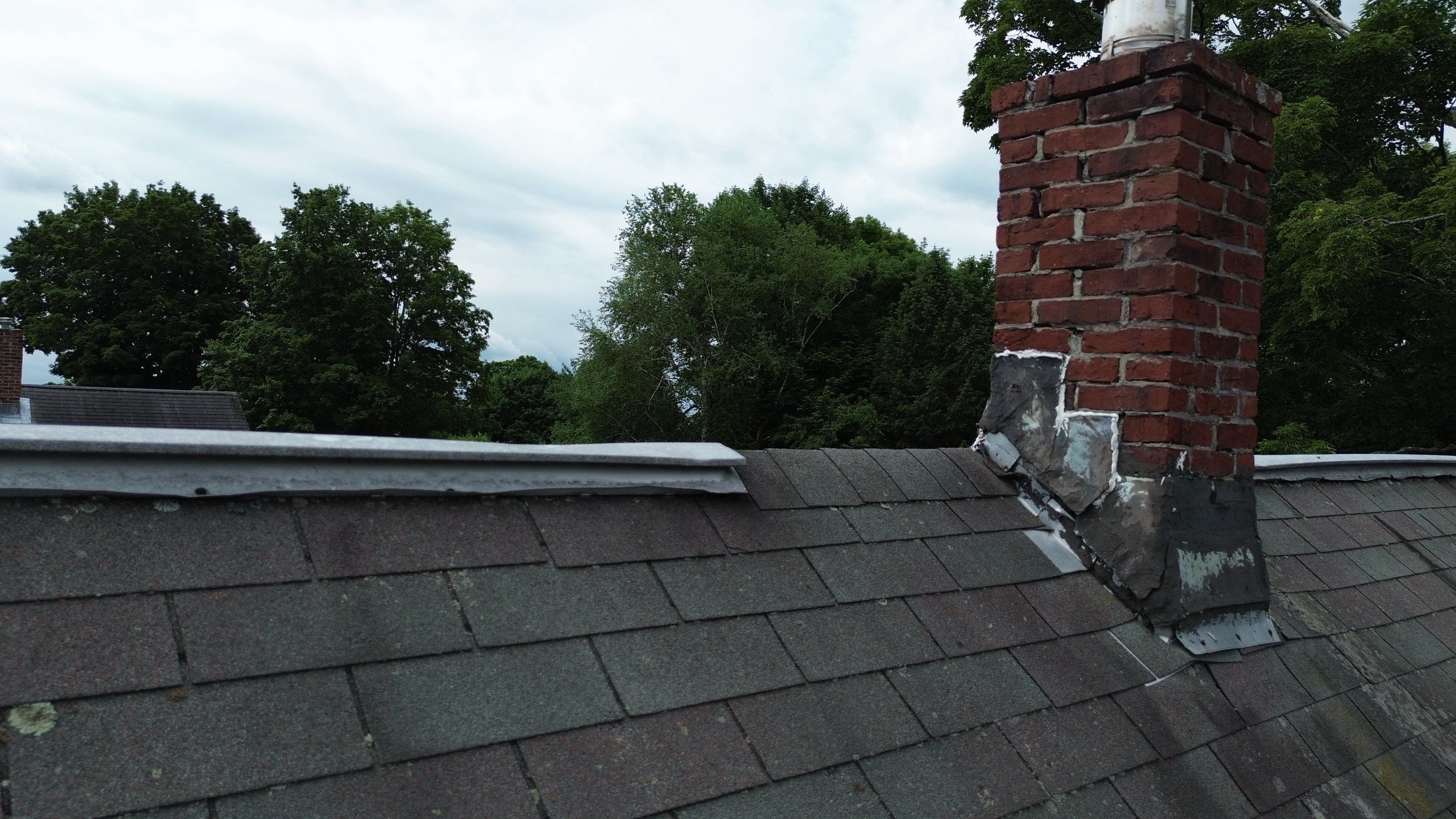 Full Roof Replacement + Custom Gutter Install | Onyx Black Finish by Mighty Dog Roofing of Greater Middlesex County
